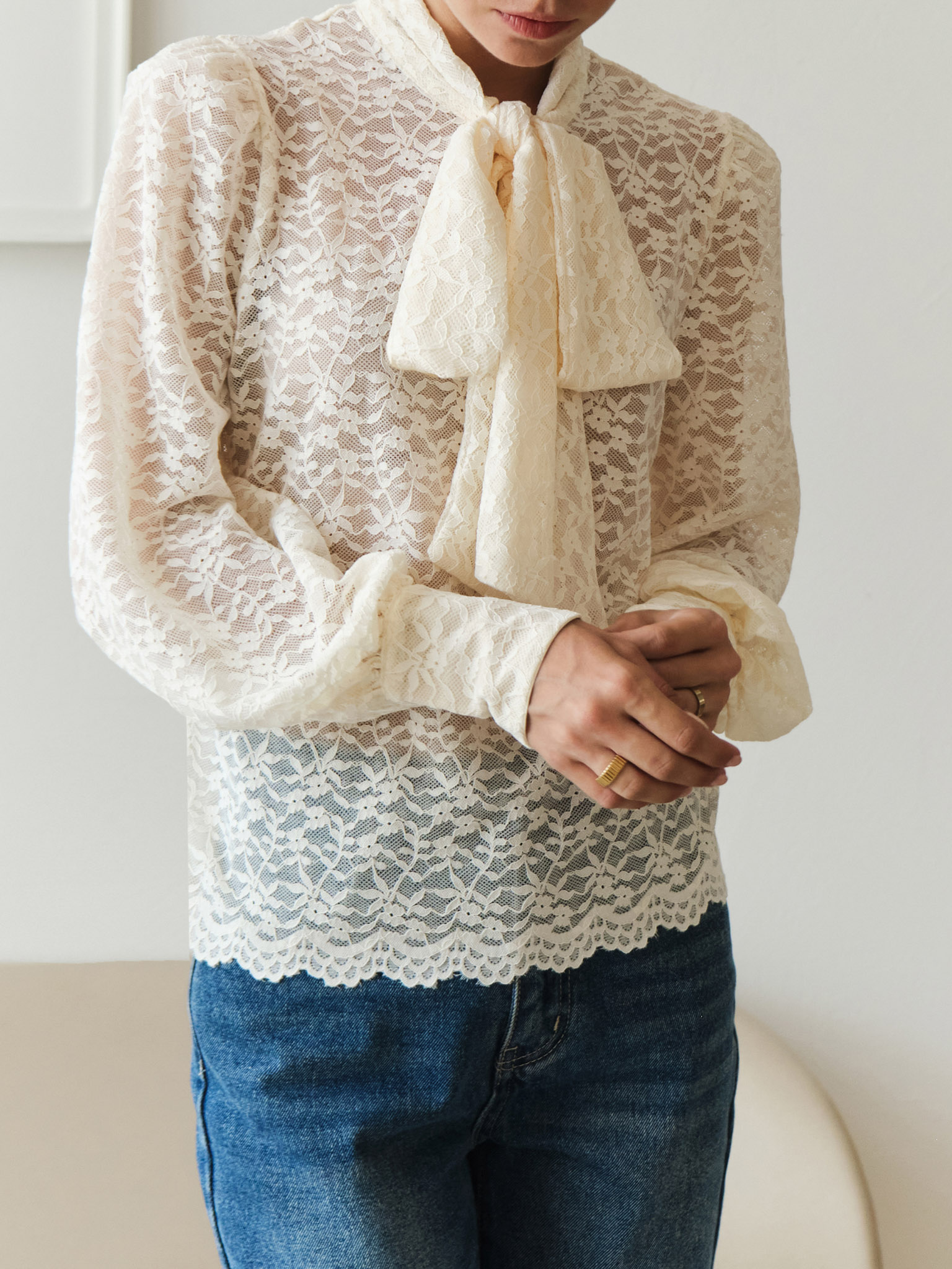 Lace blouse with a bow on the collar