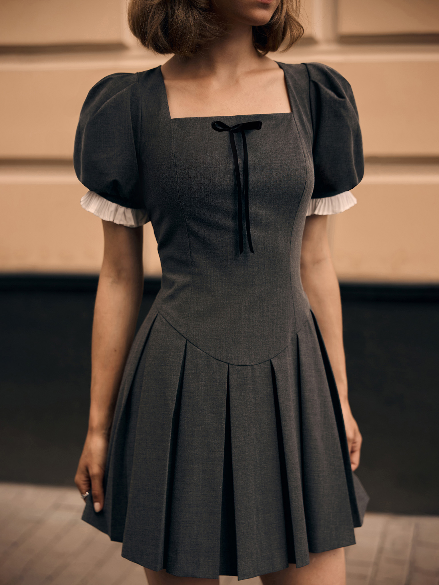 Mini dress with puff sleeves and pleated cuffs