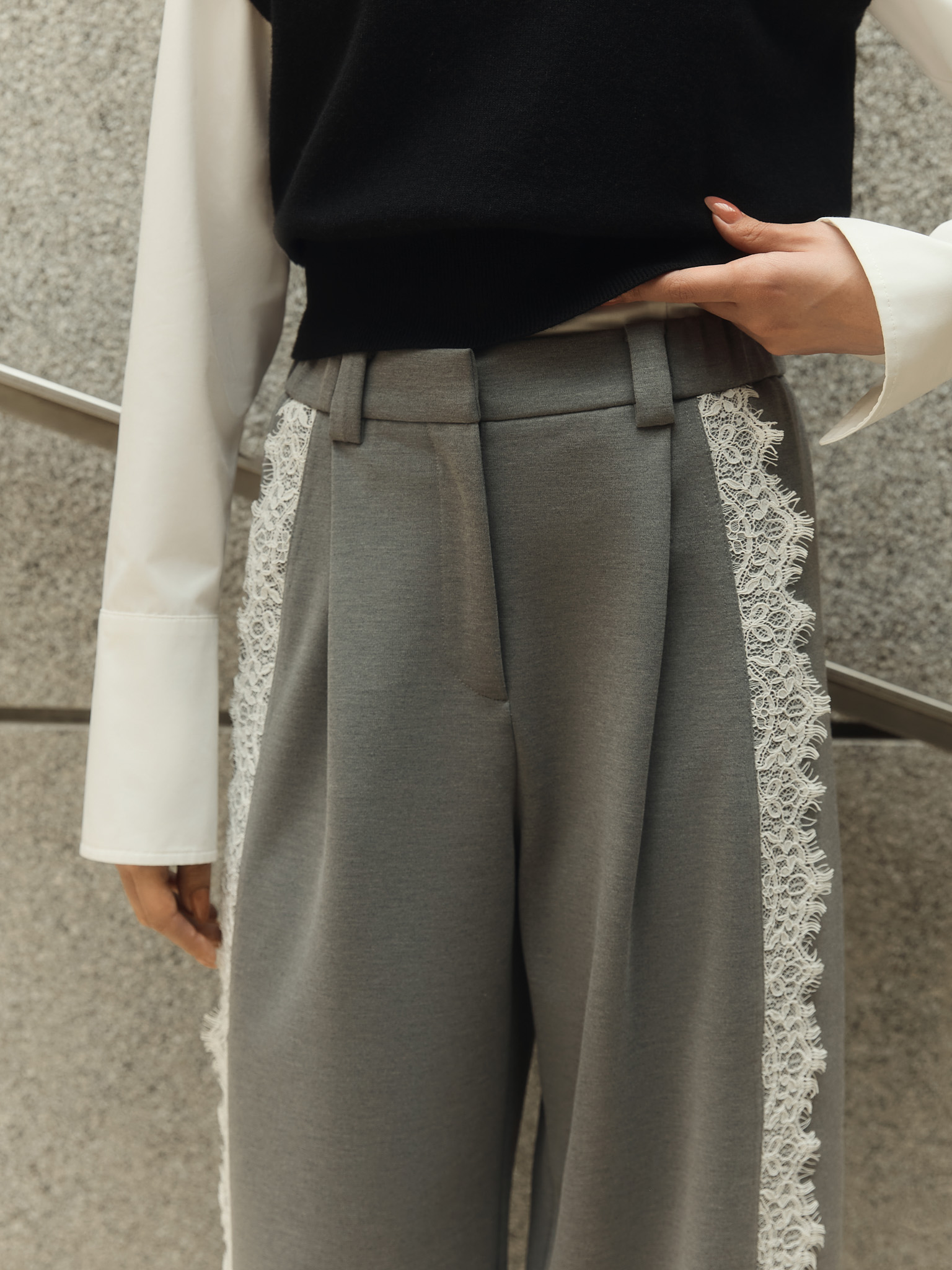 Loose trousers with lace inserts at the sides