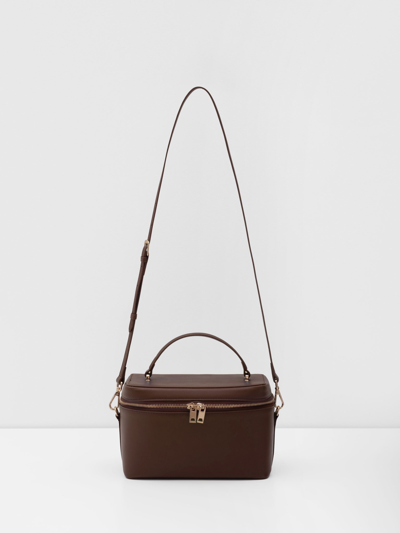 Miniature rigid-shaped shoulder bag