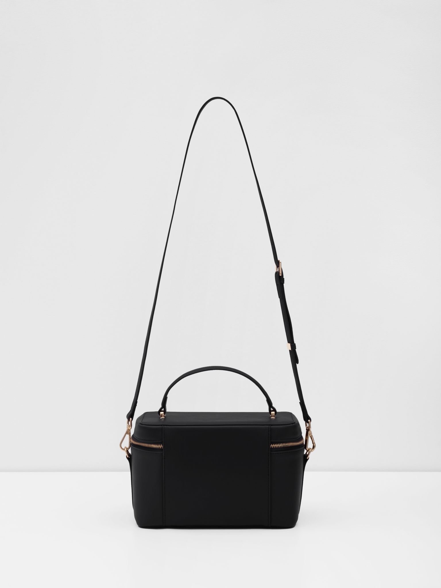 Miniature rigid-shaped shoulder bag