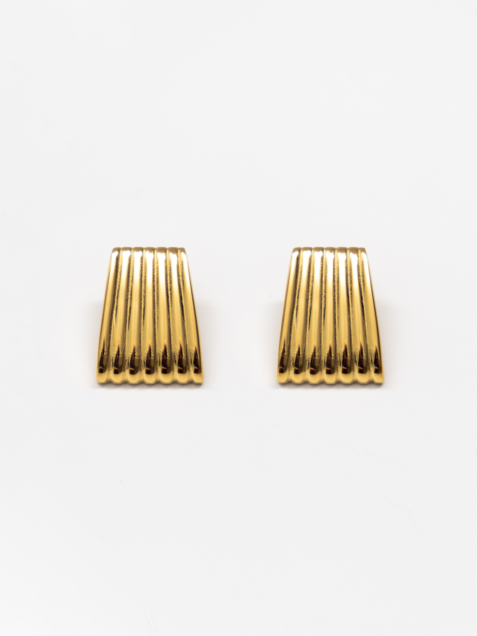 Trapezoidal stud earrings in textured metal