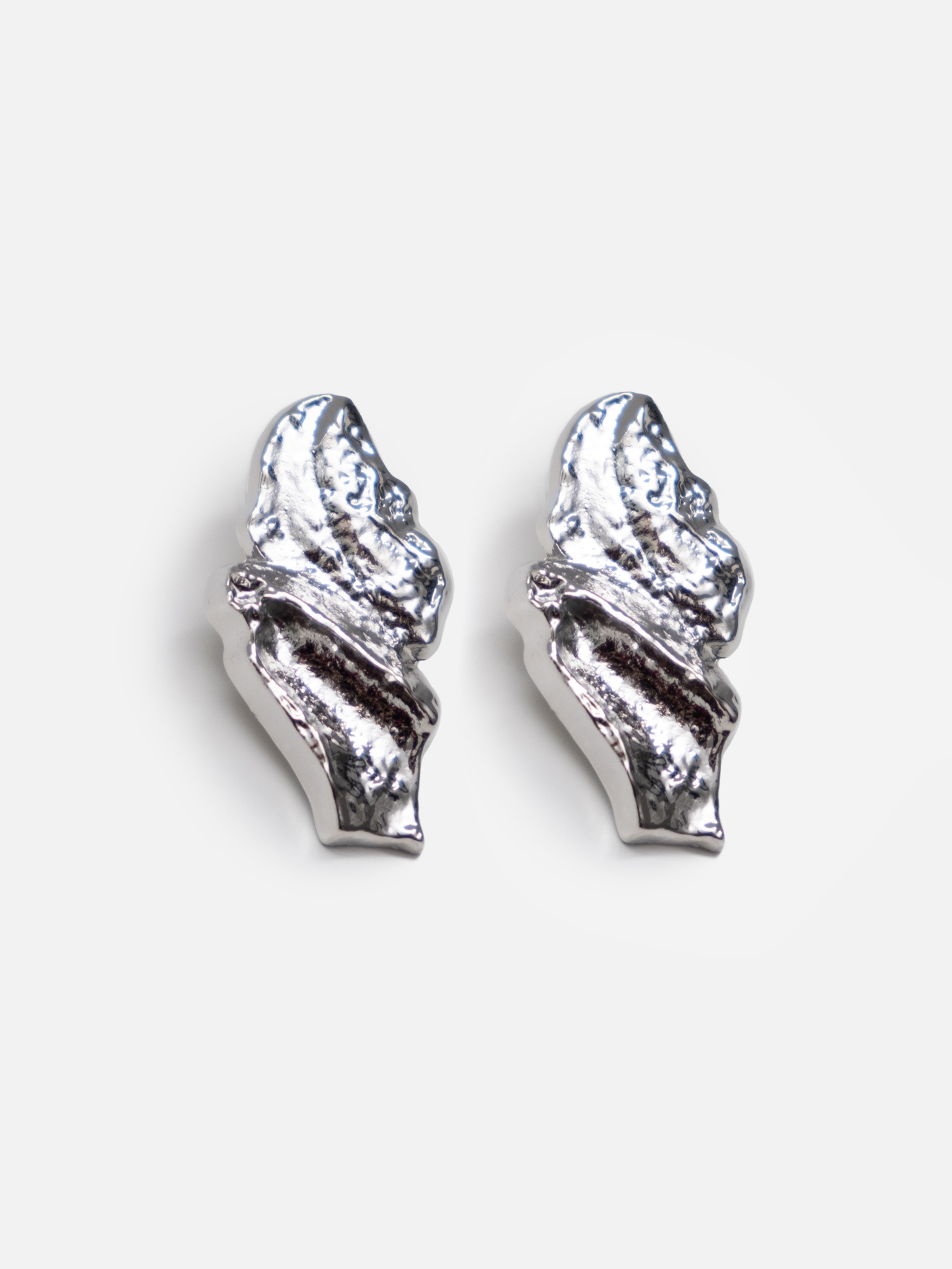 Large stud earrings in crumpled metal