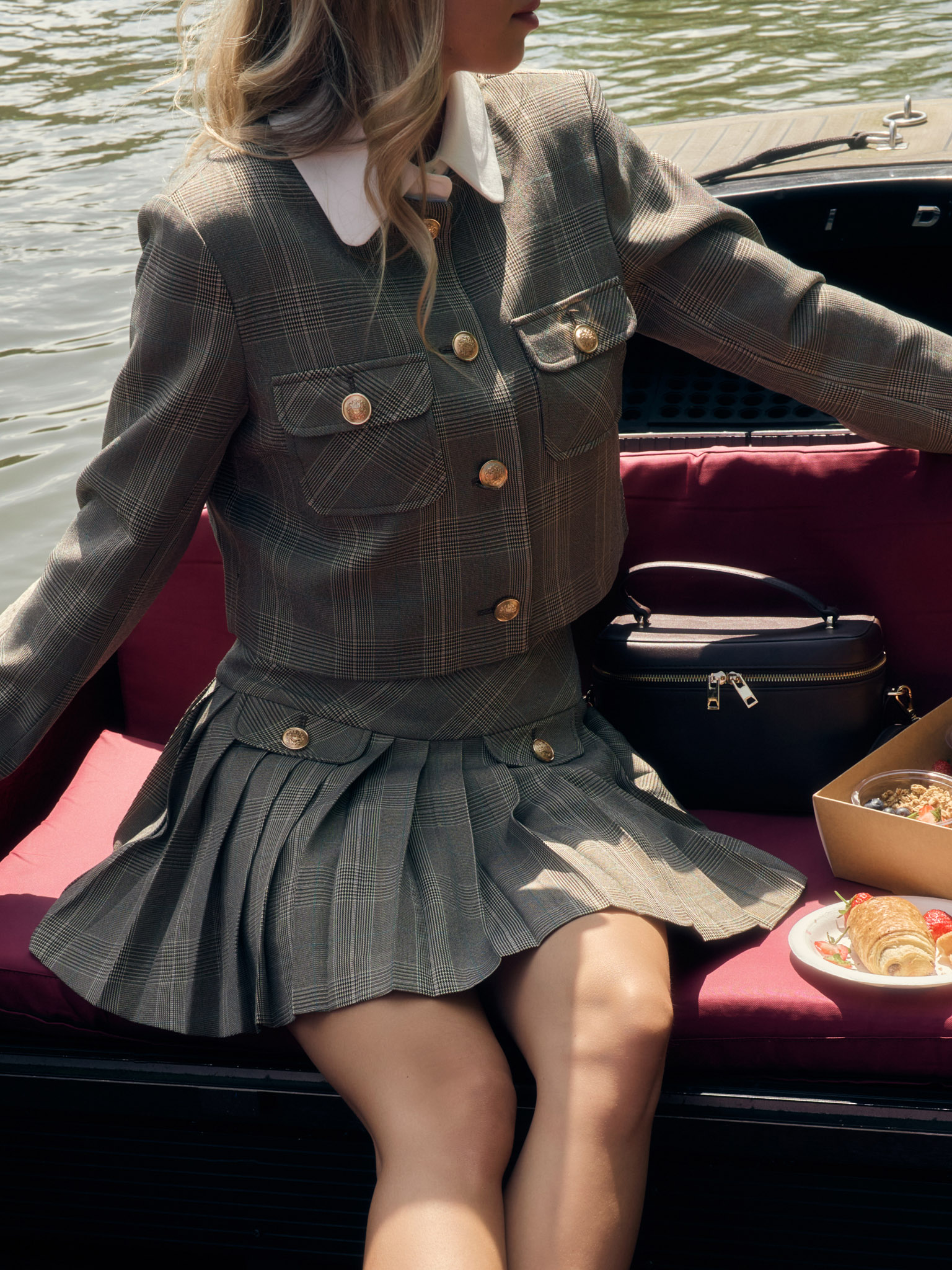 Mini checked skirt with large buttons on the pockets