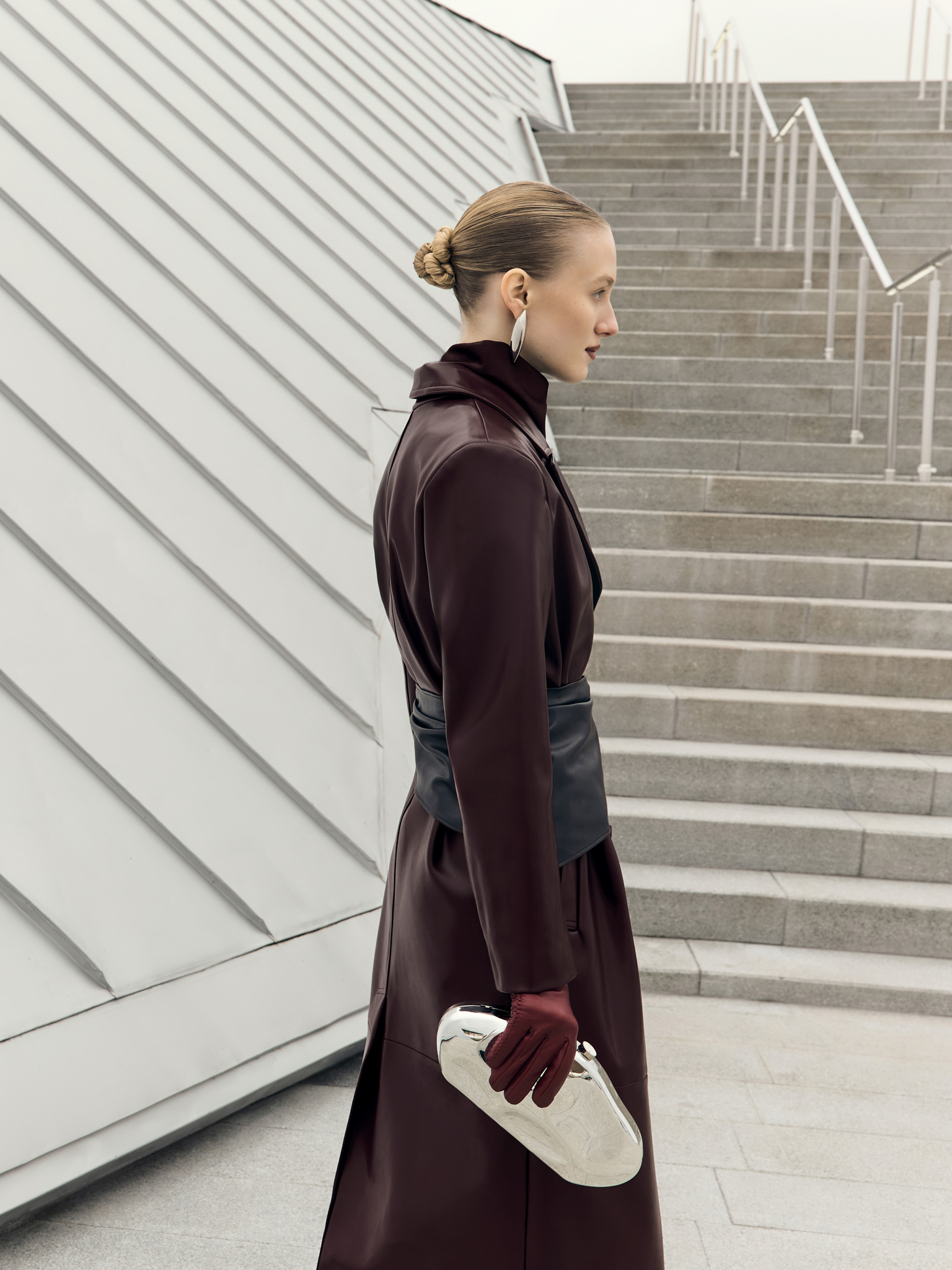 Eco-leather maxi trench with horizontal seams and tonal belt