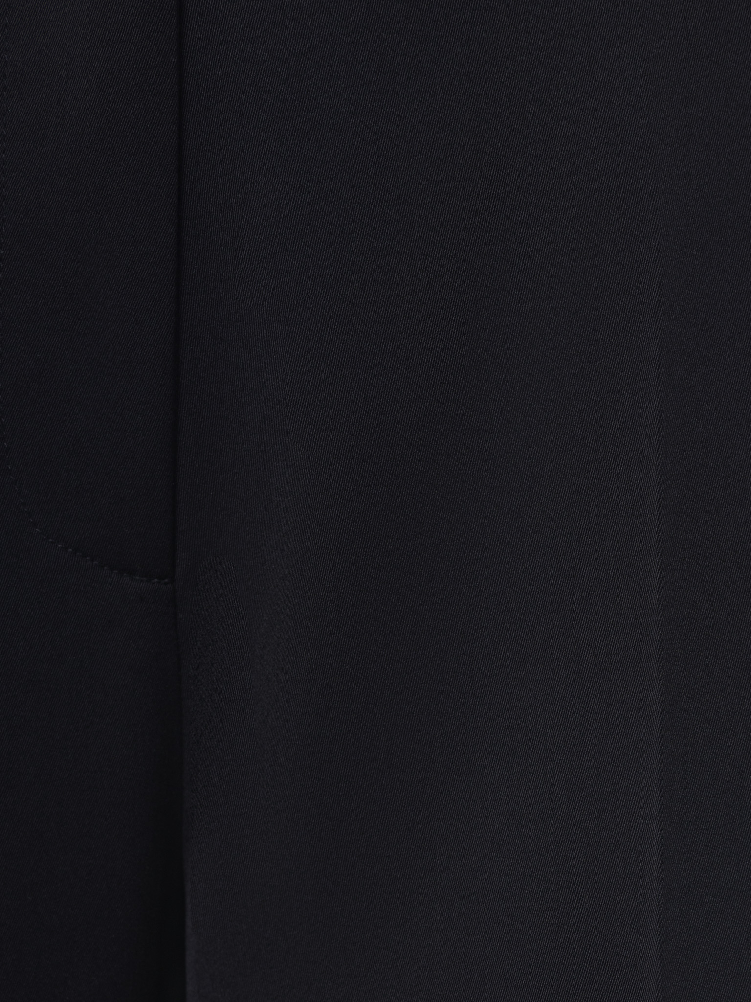 Loose suiting trousers with a belt