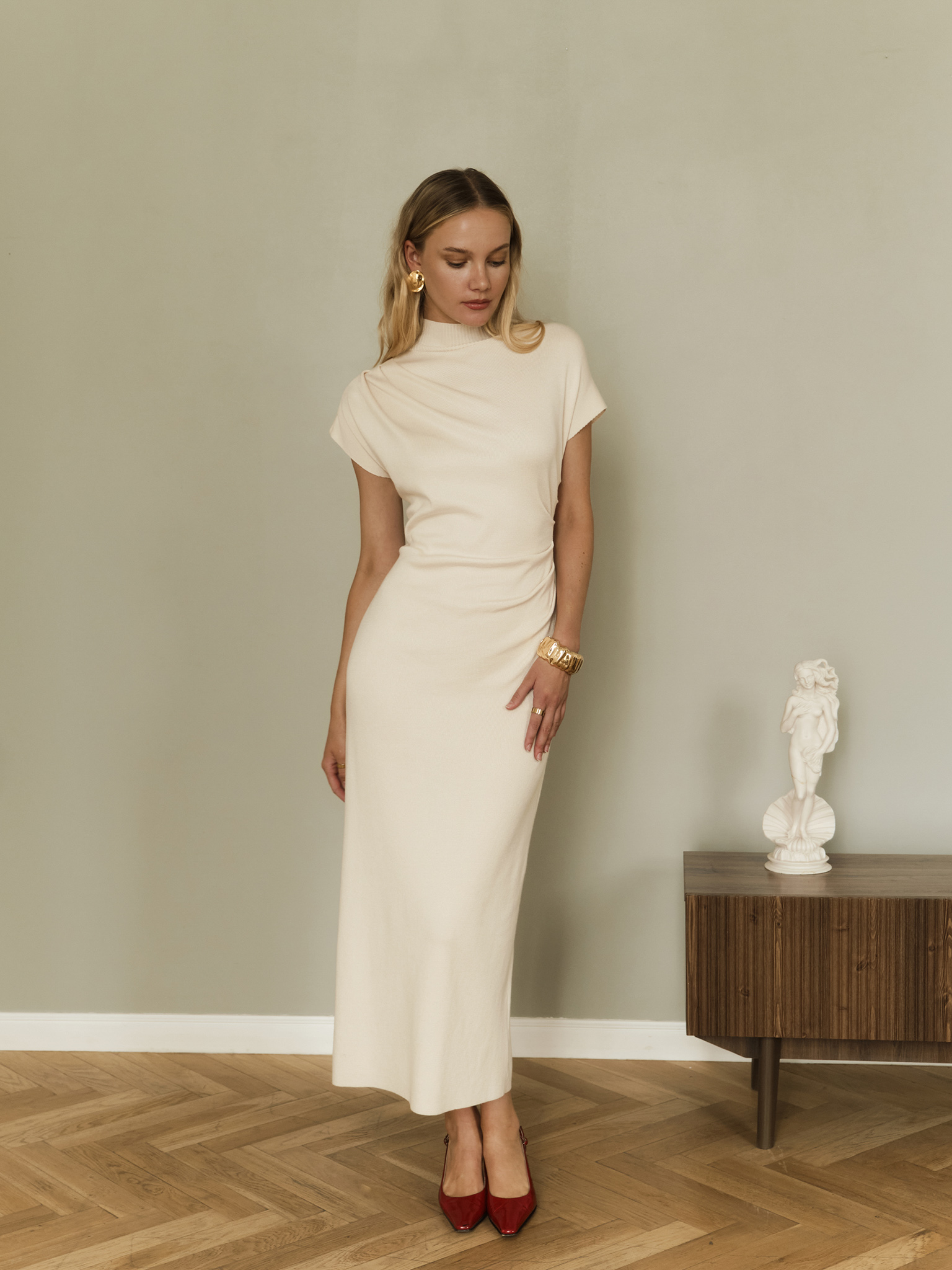 Knitted midi dress with stand-up collar and asymmetric gathers