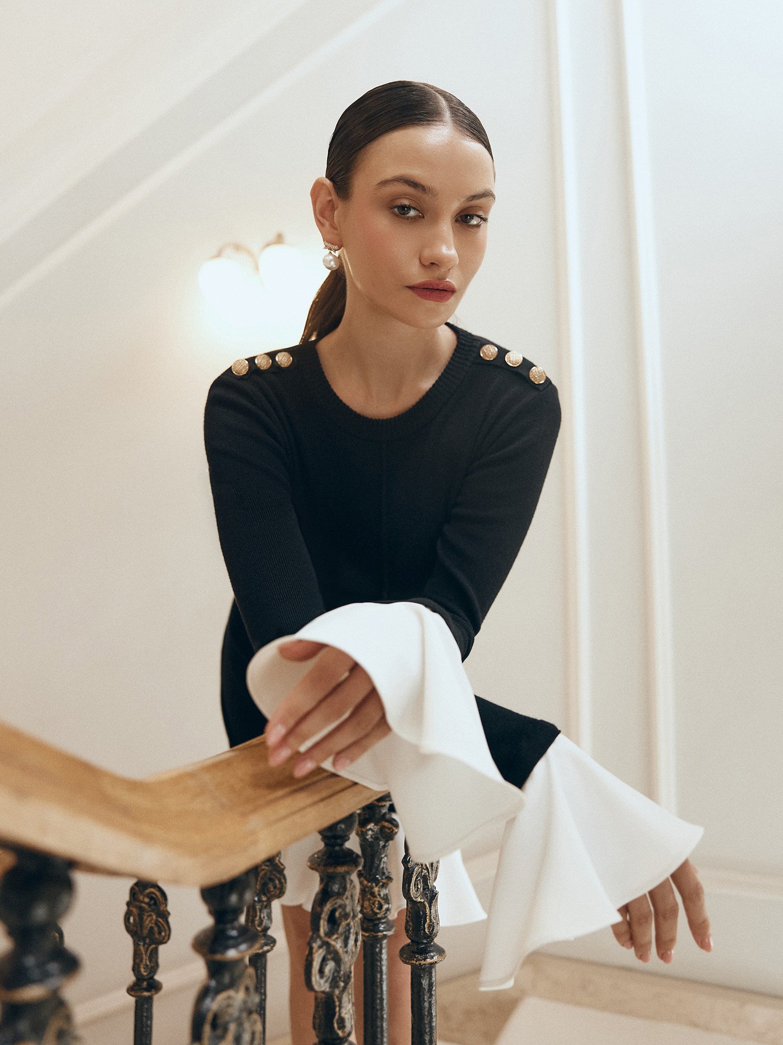 Mini knitted dress with contrasting flounces on the cuffs and skirt