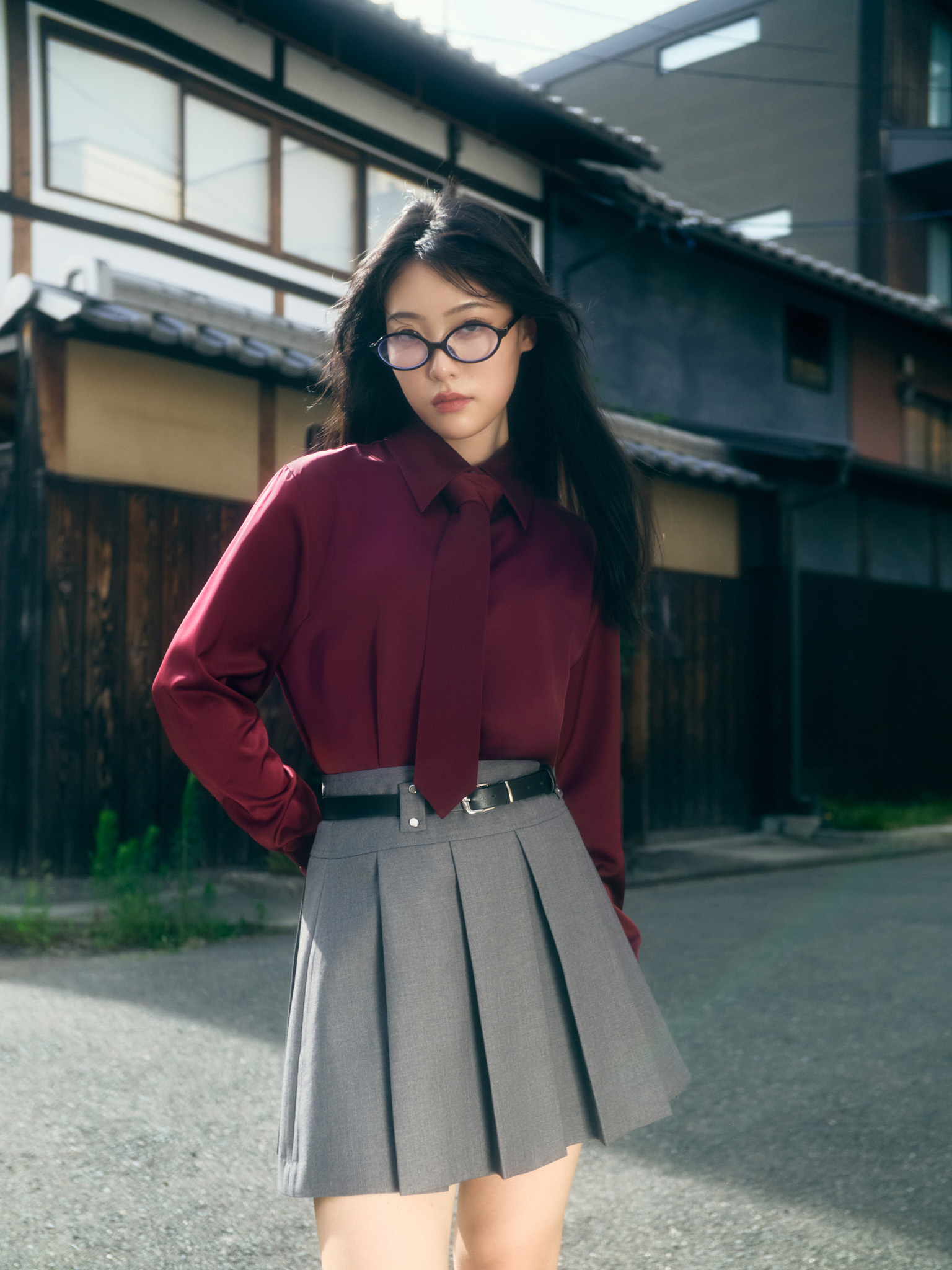 Mini pleated skirt with eco-leather belt