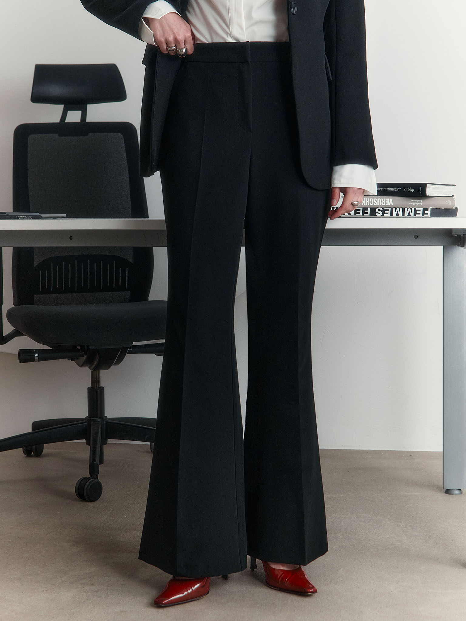 Flared trousers with stitched crease