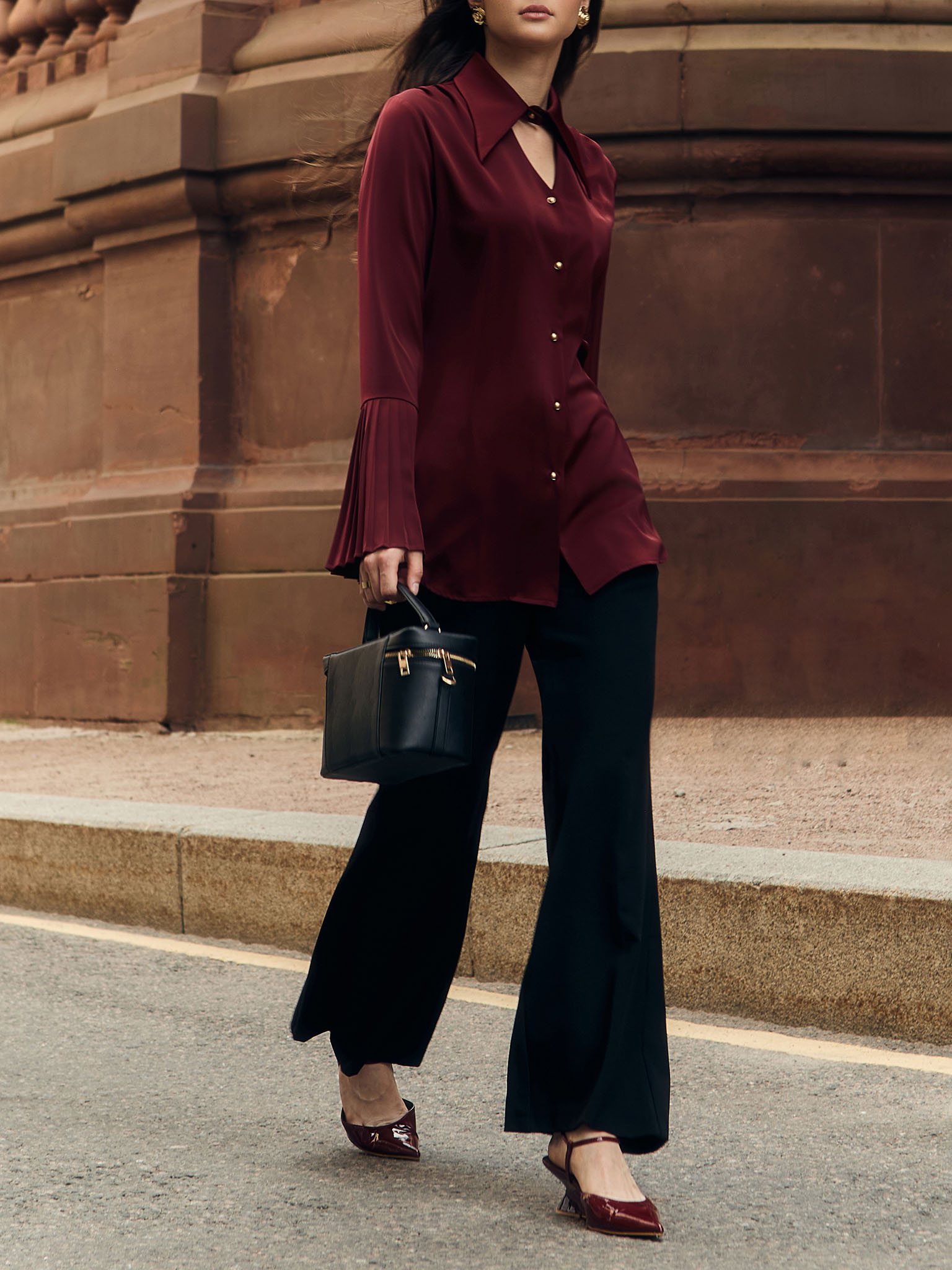 Flared trousers with stitched crease