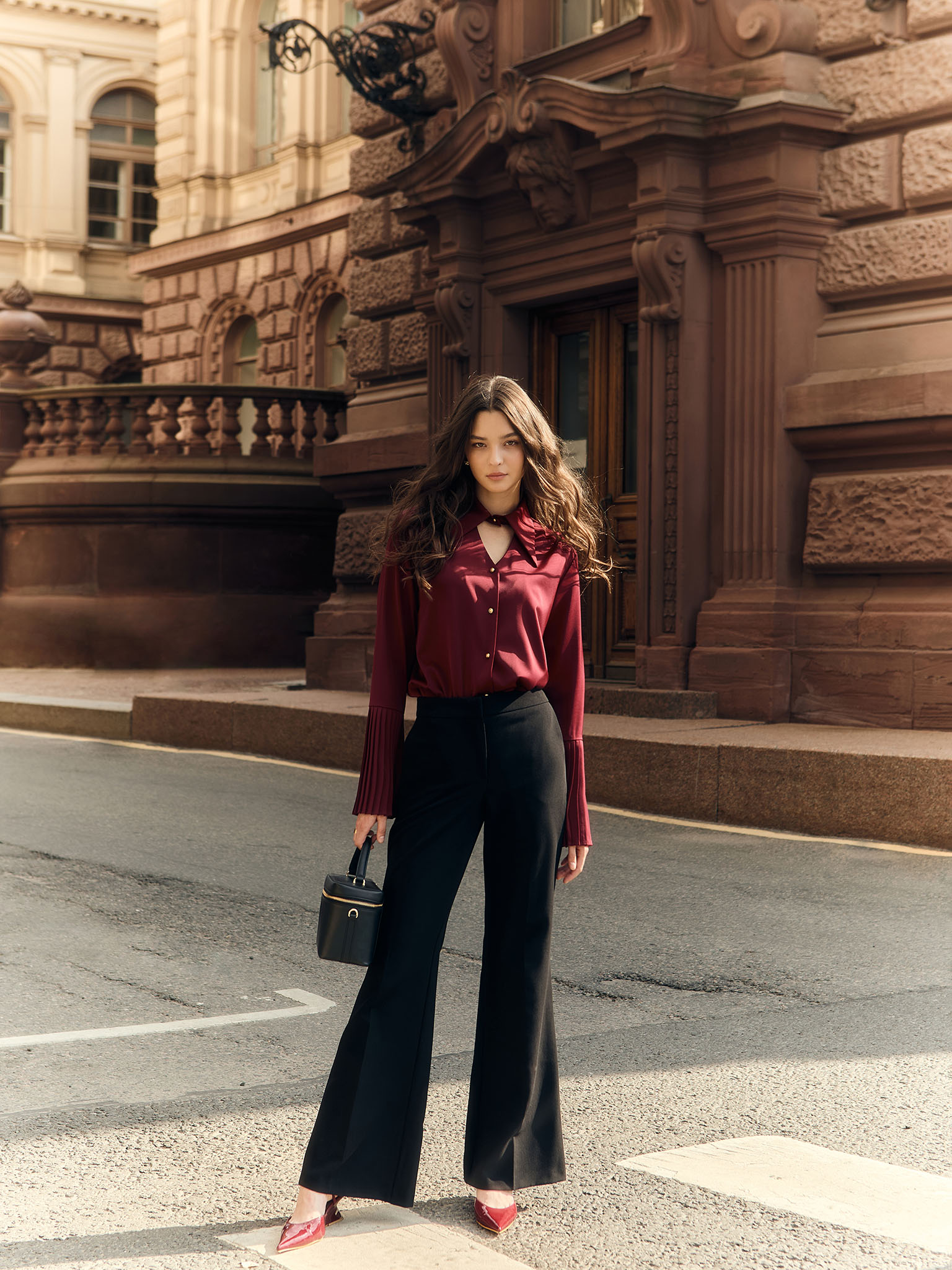 Flared trousers with stitched crease