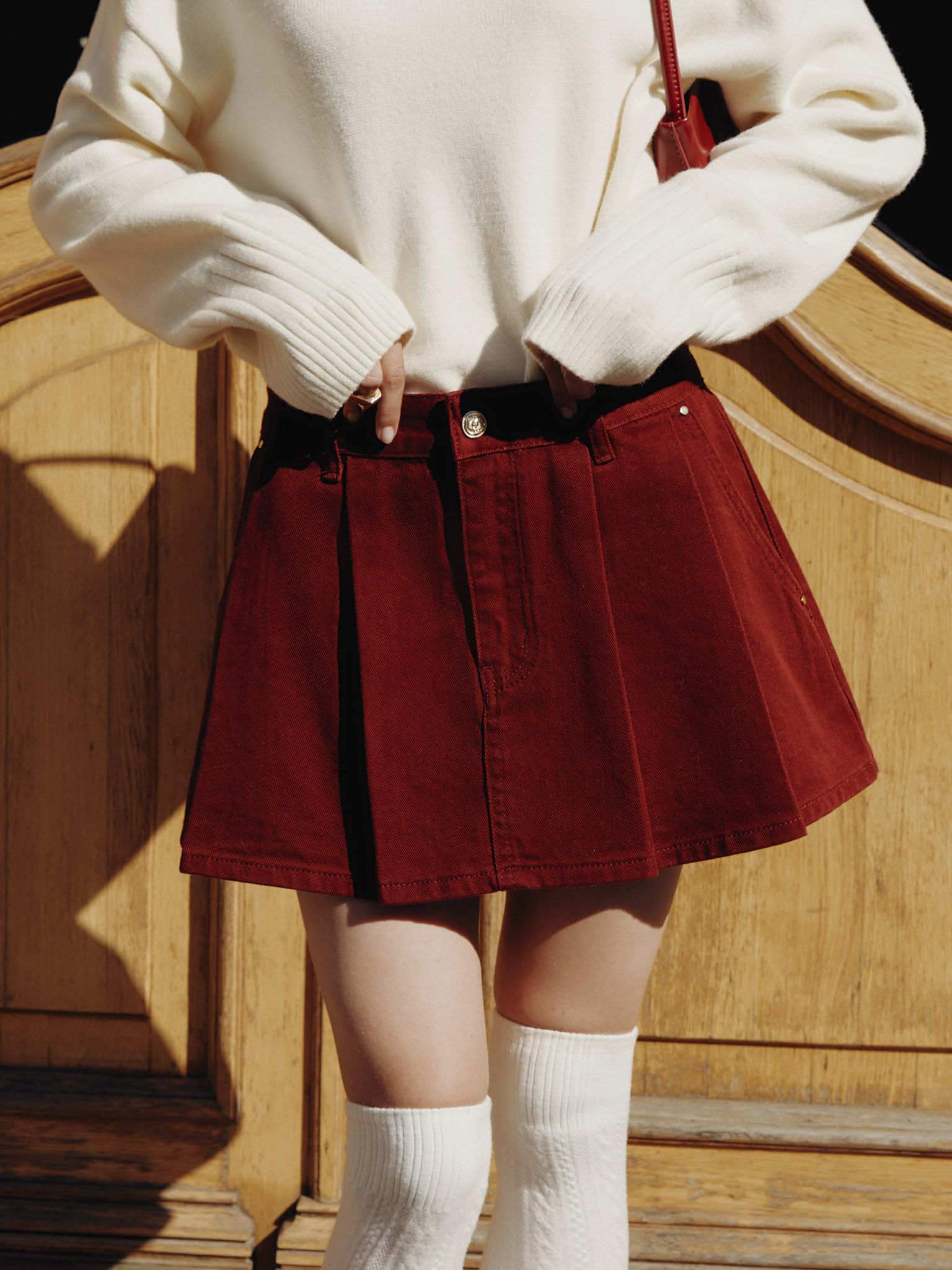 Mini denim skirt with pleats