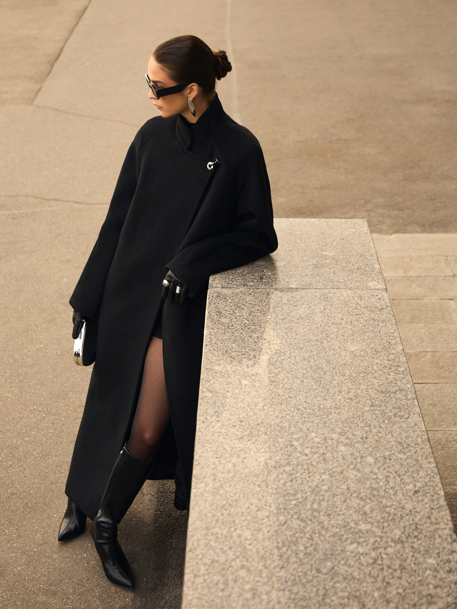 Woollen maxi coat with metal clasp at the shoulder