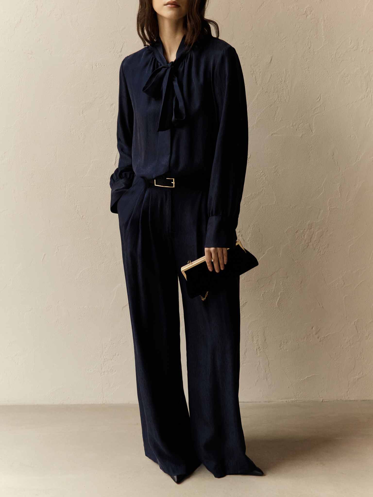 Loose blouse with ribbons on the collar