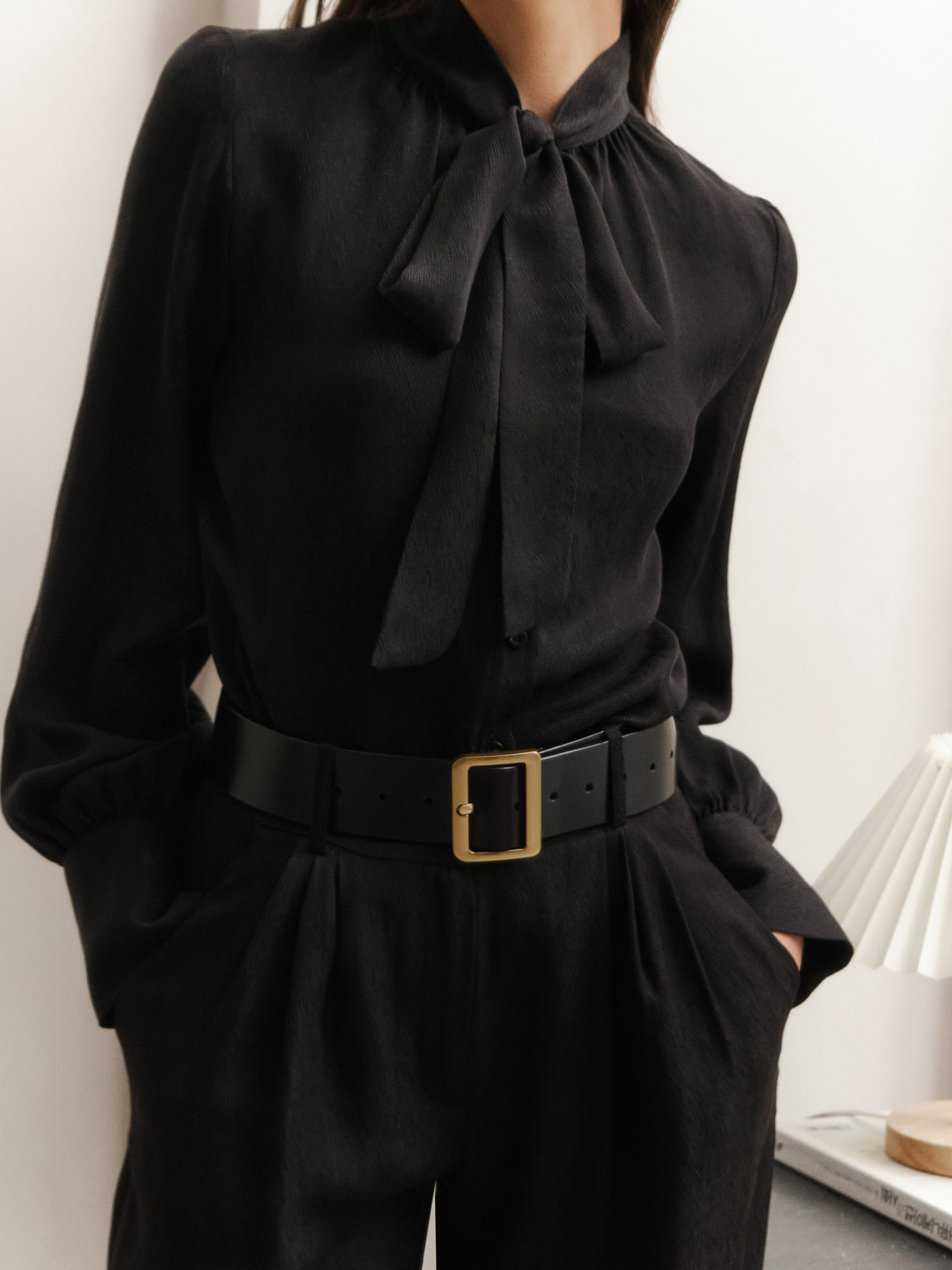 Loose blouse with ribbons on the collar