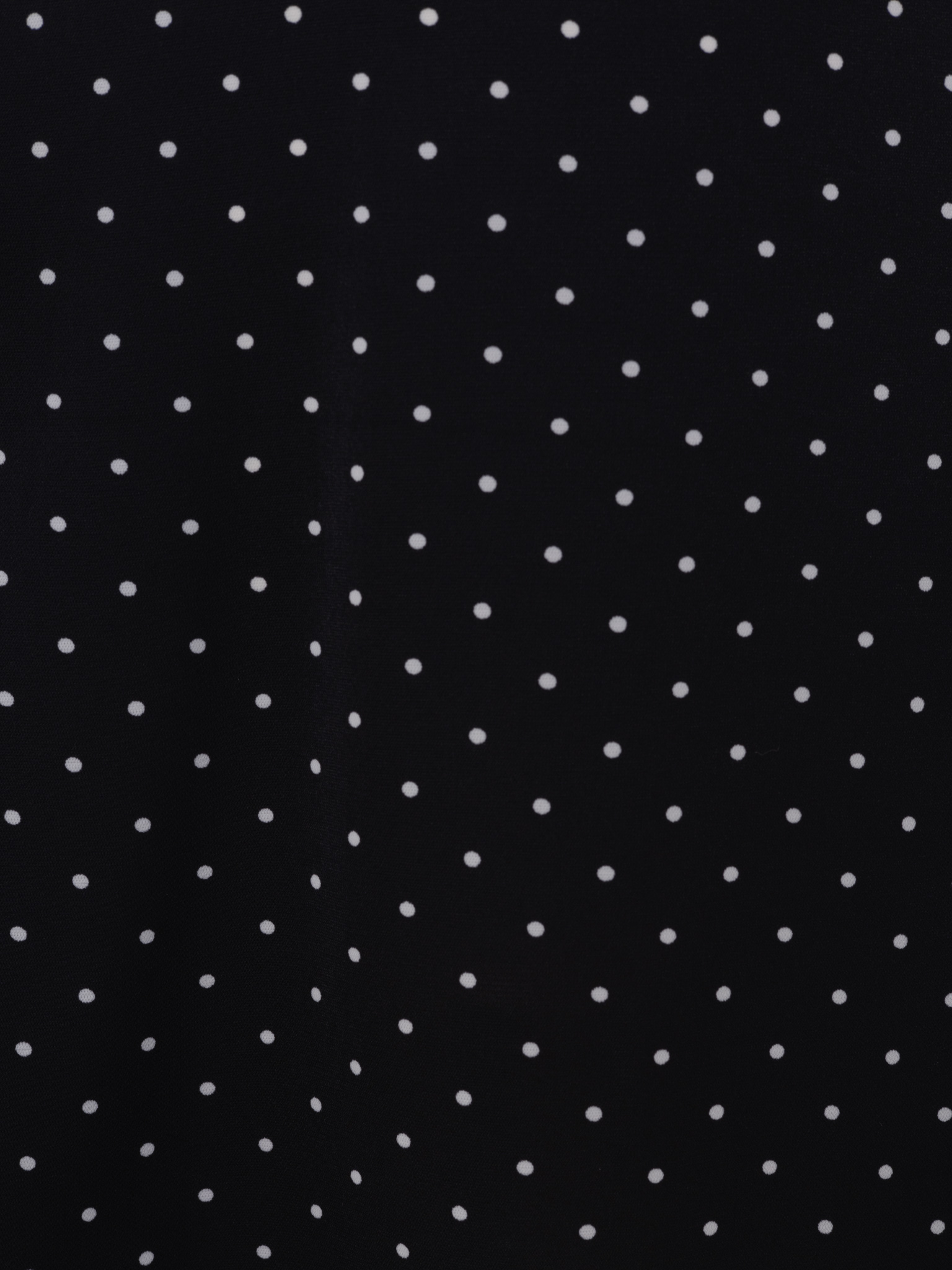 Mini polka-dot dress with contrasting flower