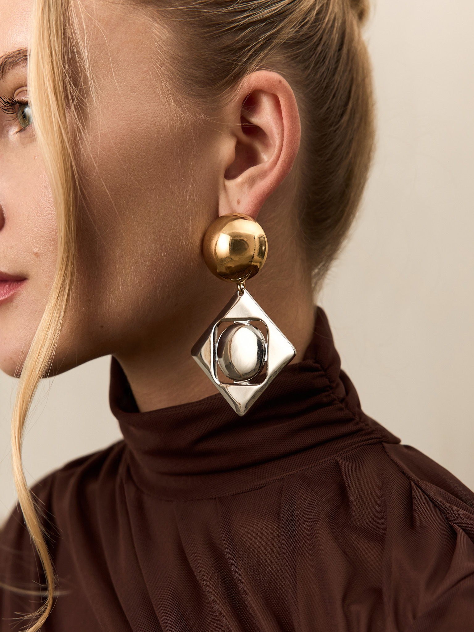 Geometric stud earrings in two metals