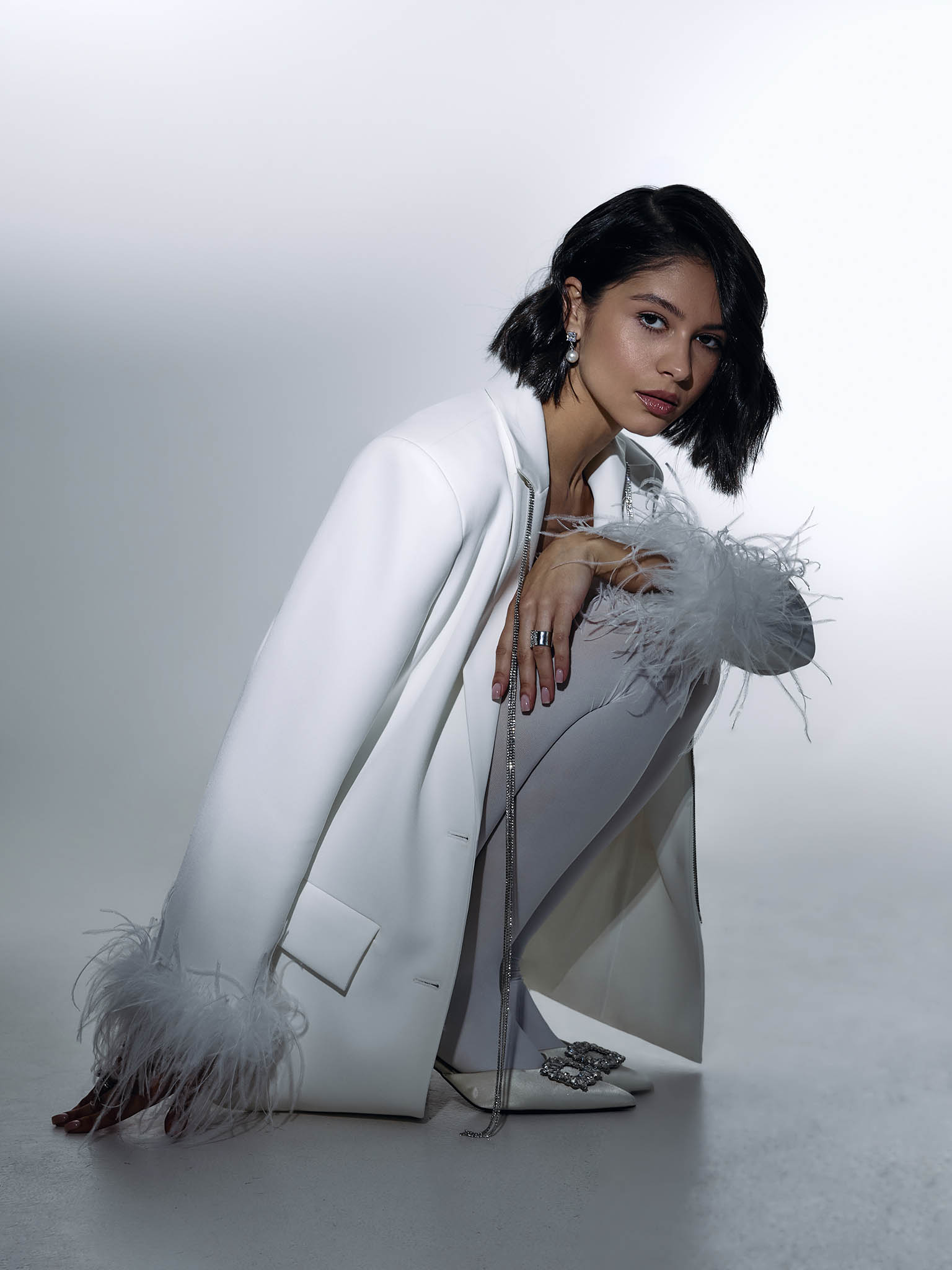 Single-breasted jacket with accent buttons and feathers