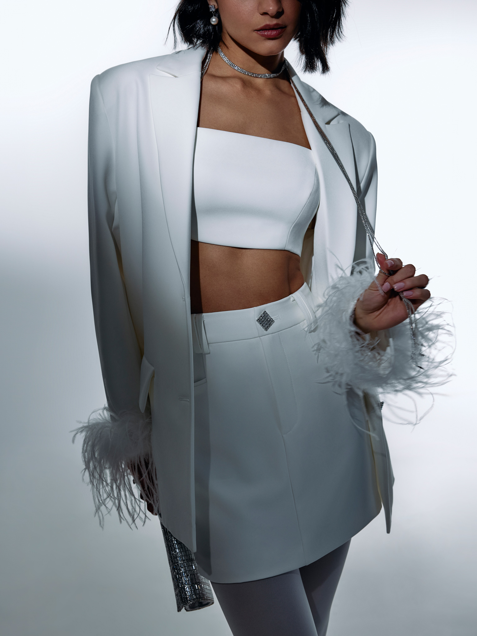 Single-breasted jacket with accent buttons and feathers