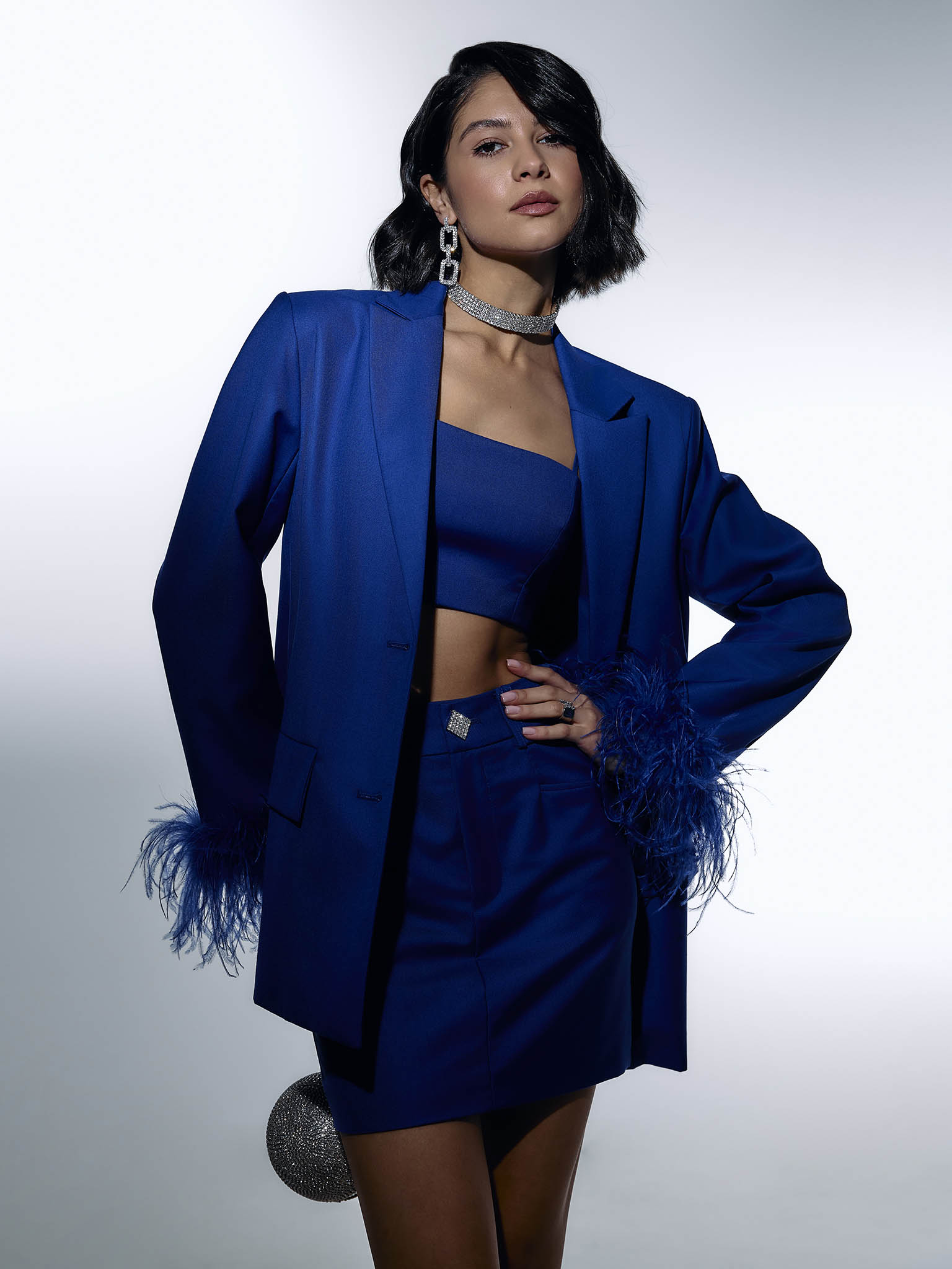 Single-breasted jacket with accent buttons and feathers