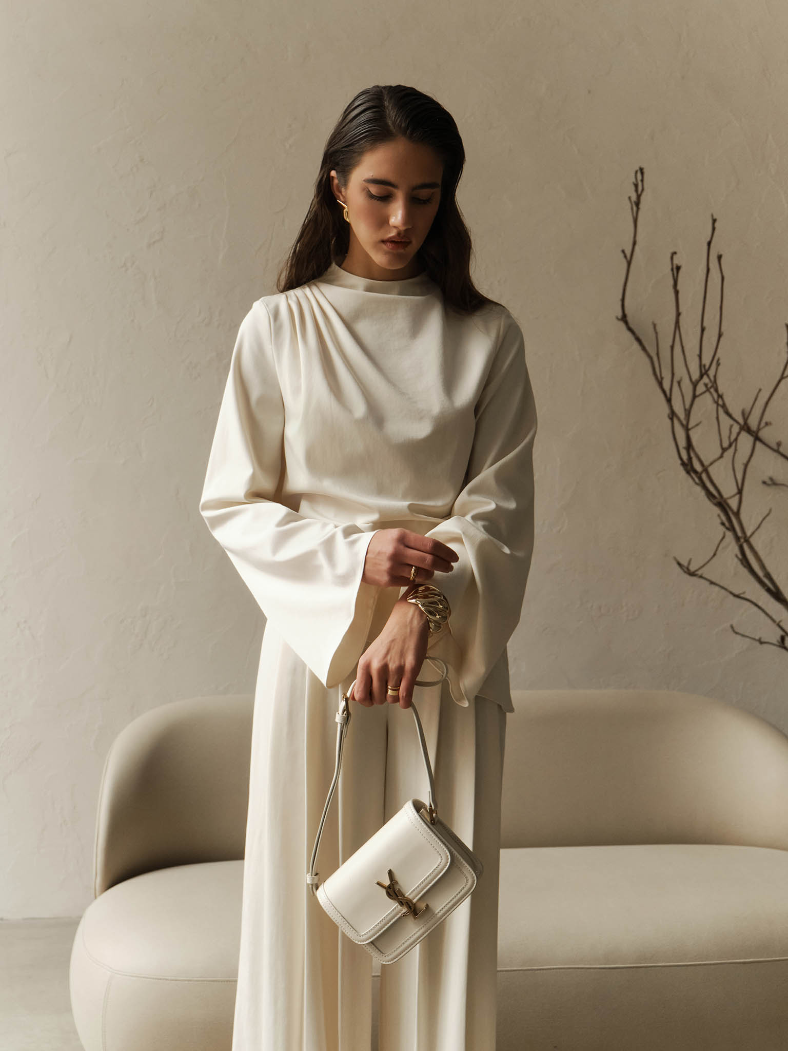 Blouse with draped shoulder and voluminous sleeves