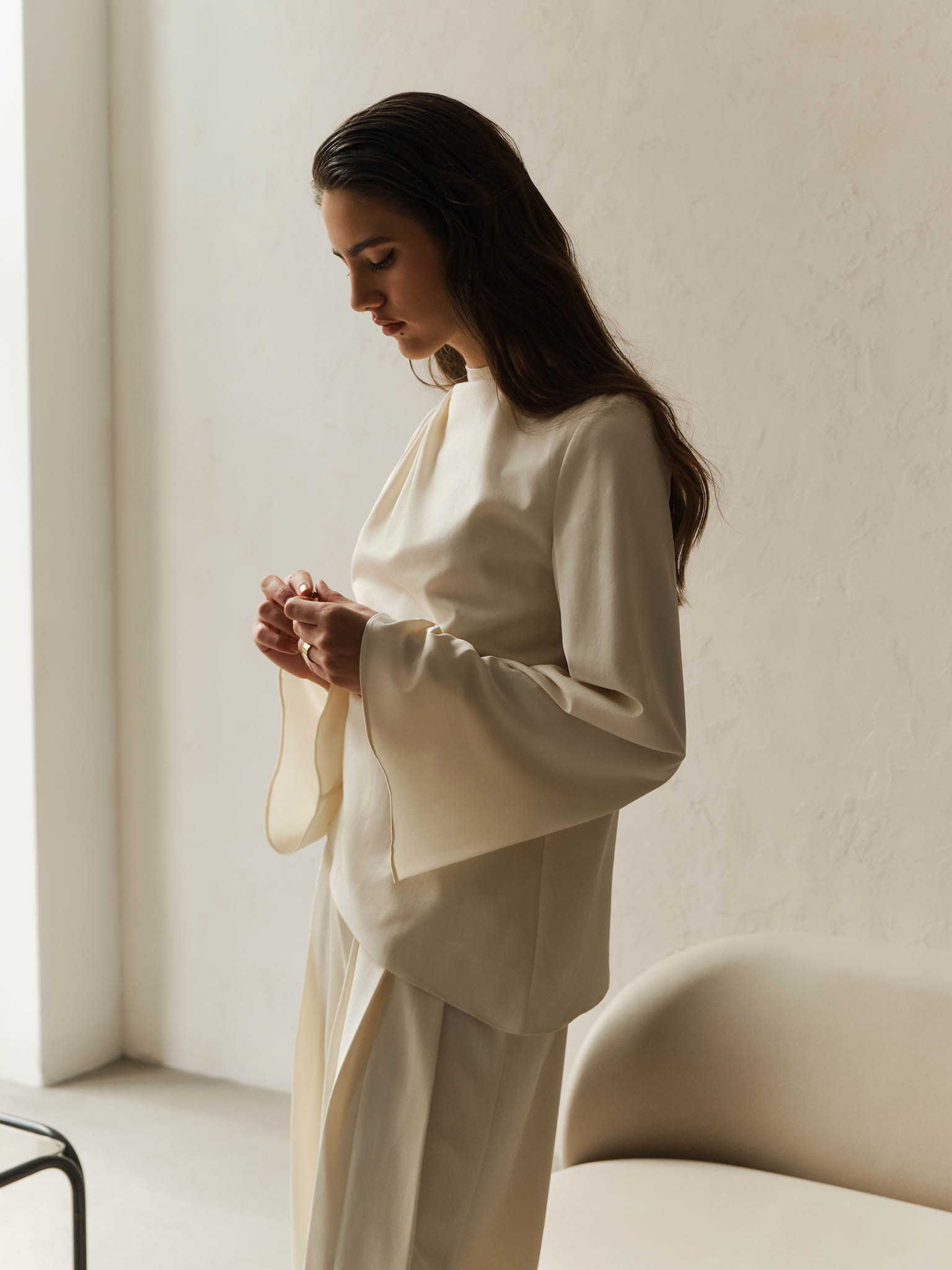 Blouse with draped shoulder and voluminous sleeves