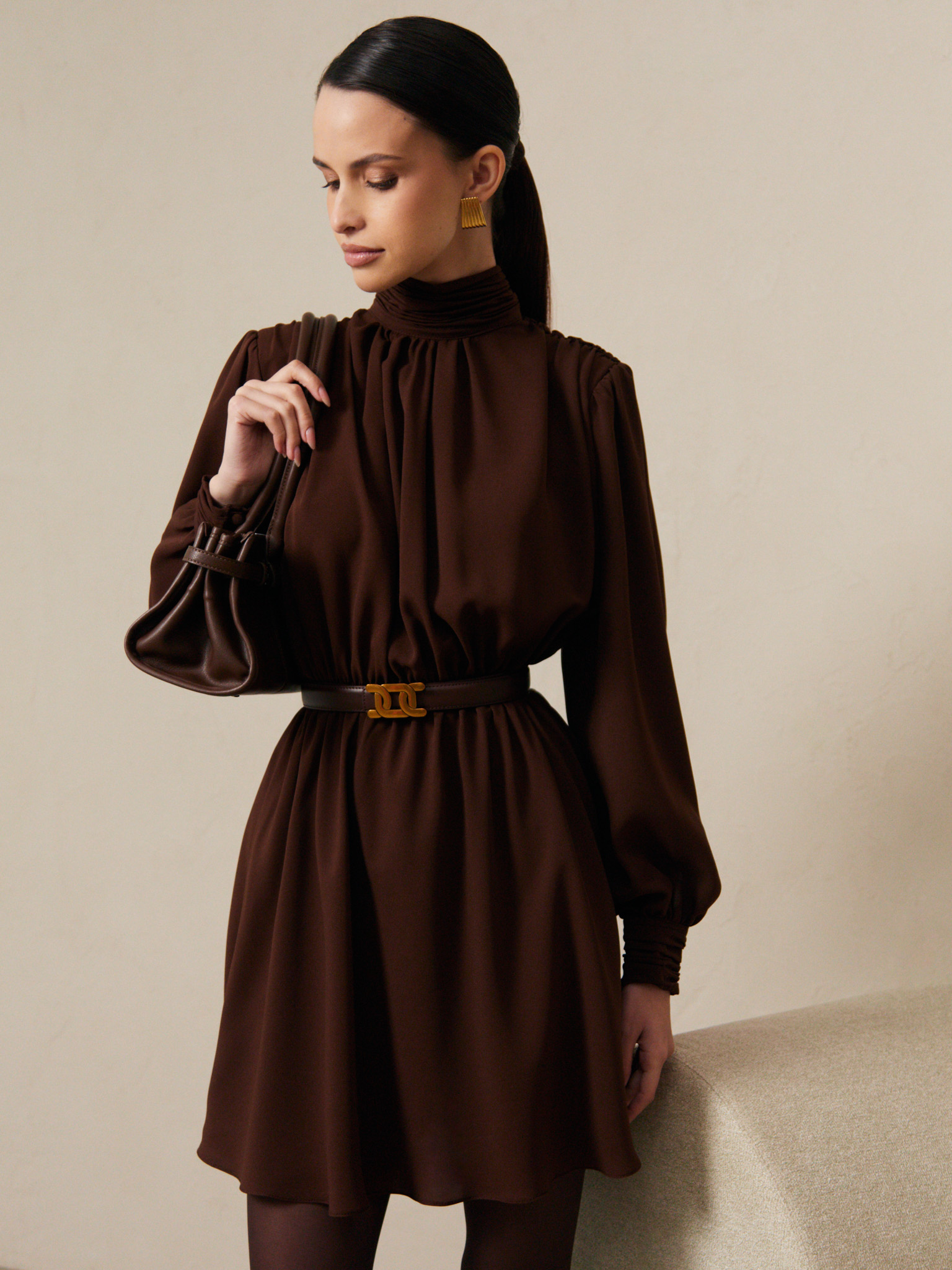 Mini dress with pleats on the shoulders and open back