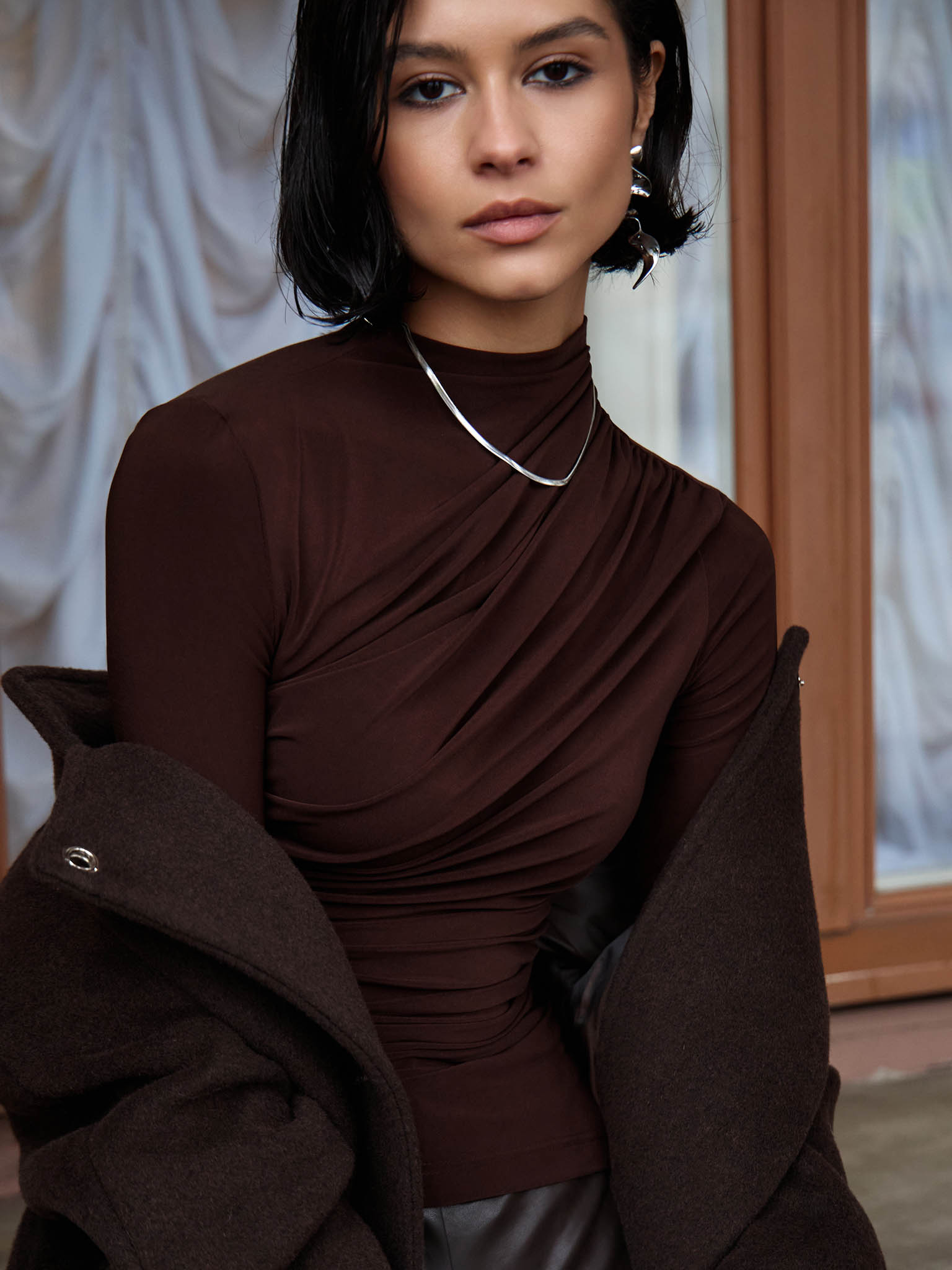 Jersey turtleneck with waist drapery