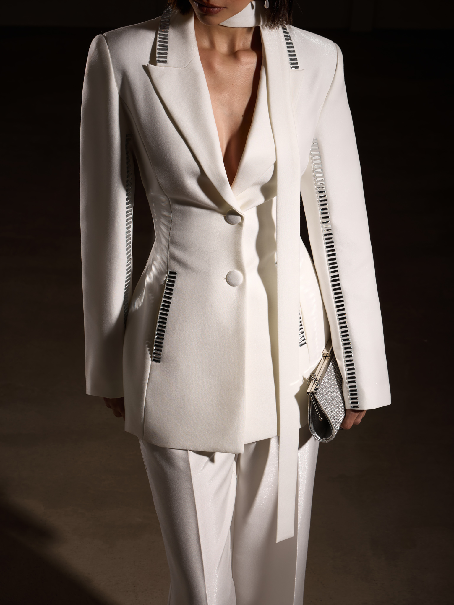 Trousers with slits on the pant legs and silvertone decor