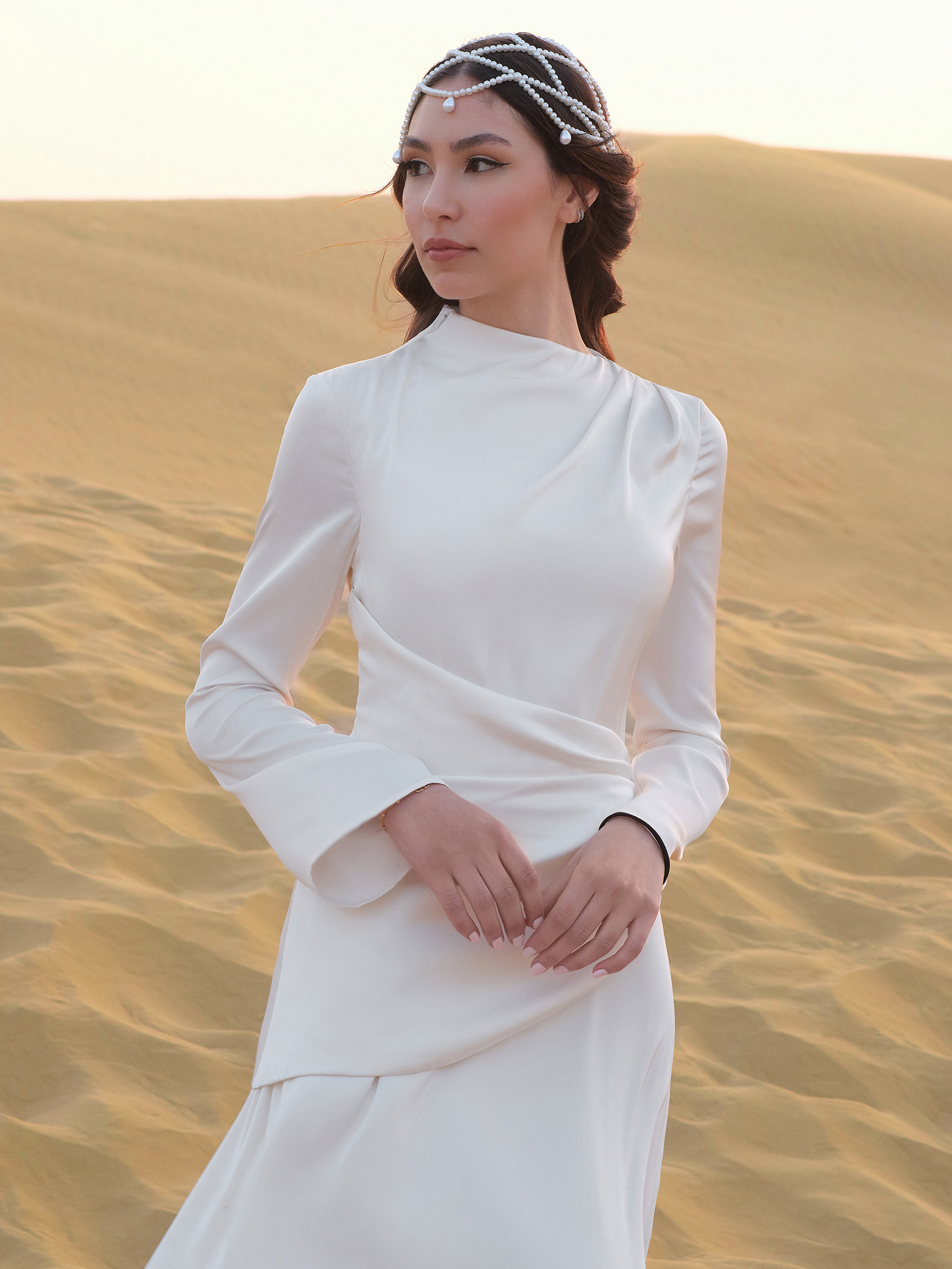Long sleeved maxi dress with draping at the waist