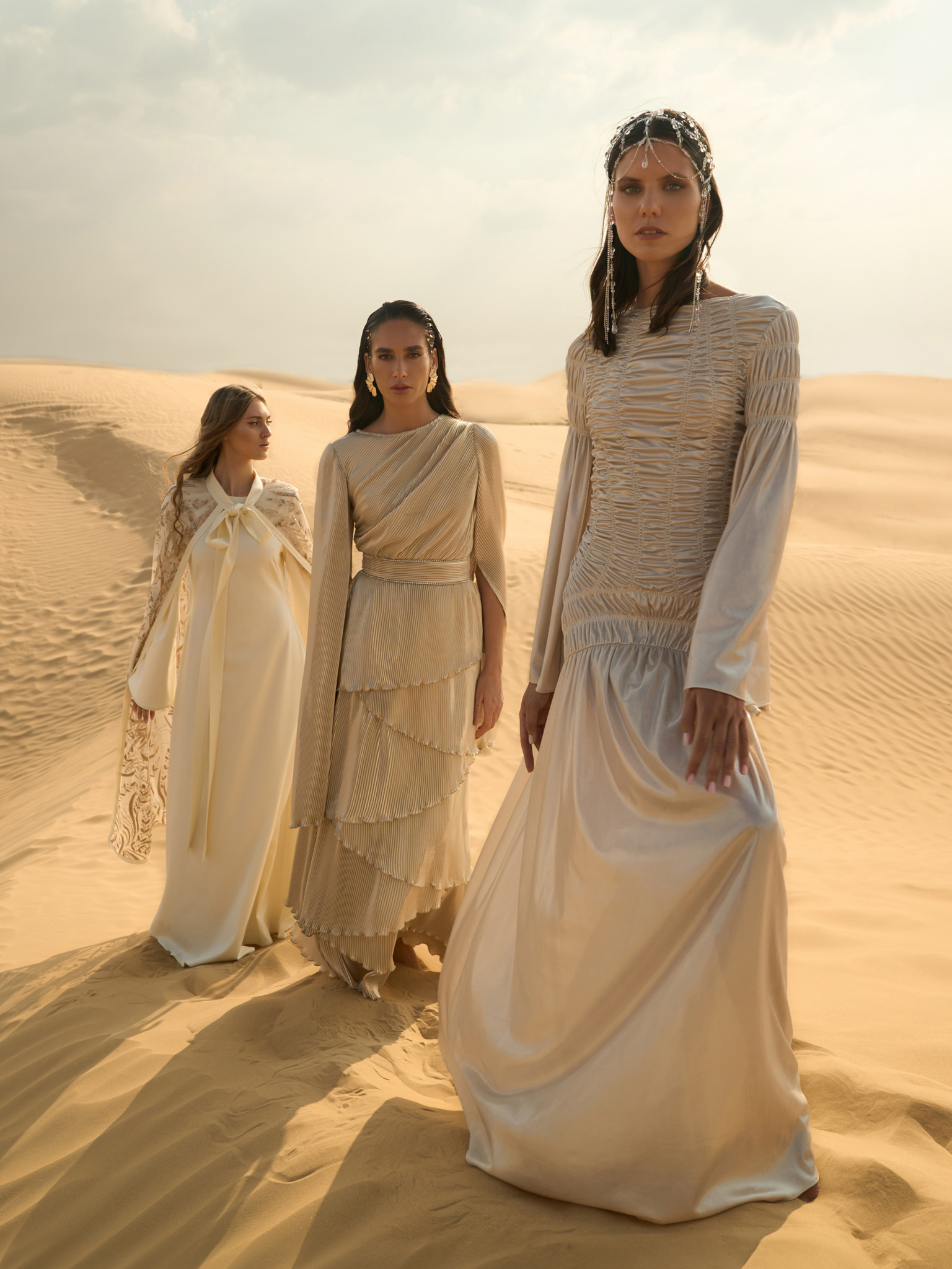 Pleated maxi dress with layered skirt and rhinestone decor at the waist