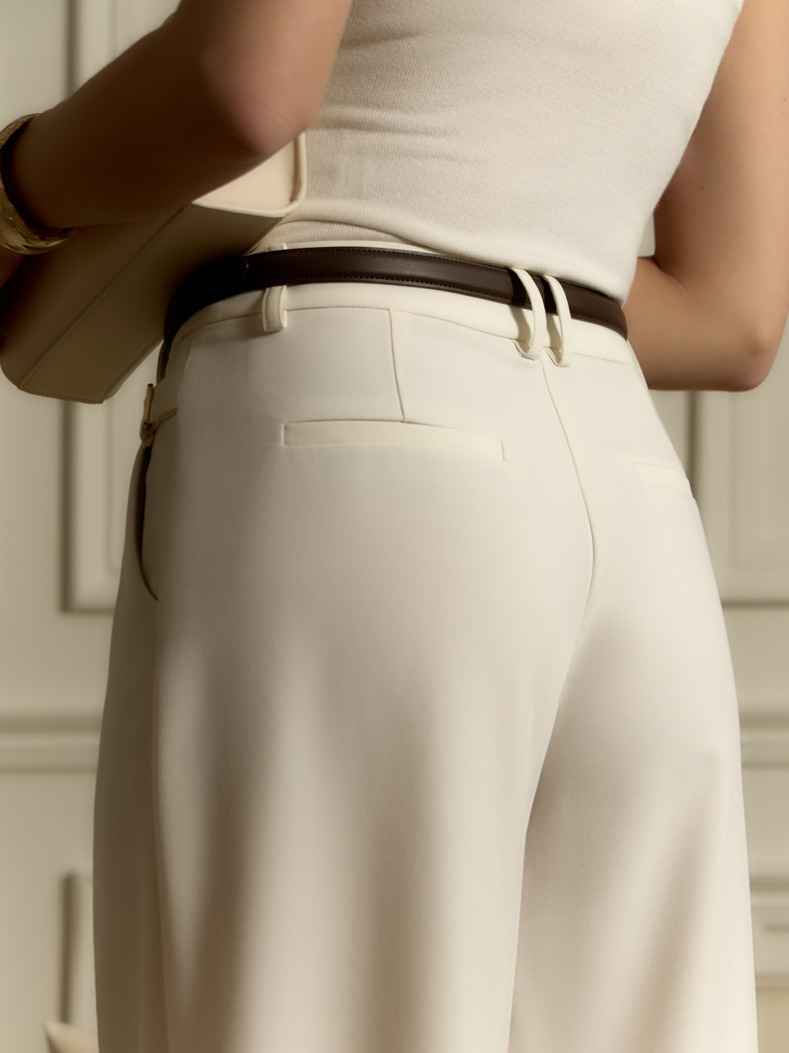 Loose suiting trousers with eco-leather belt