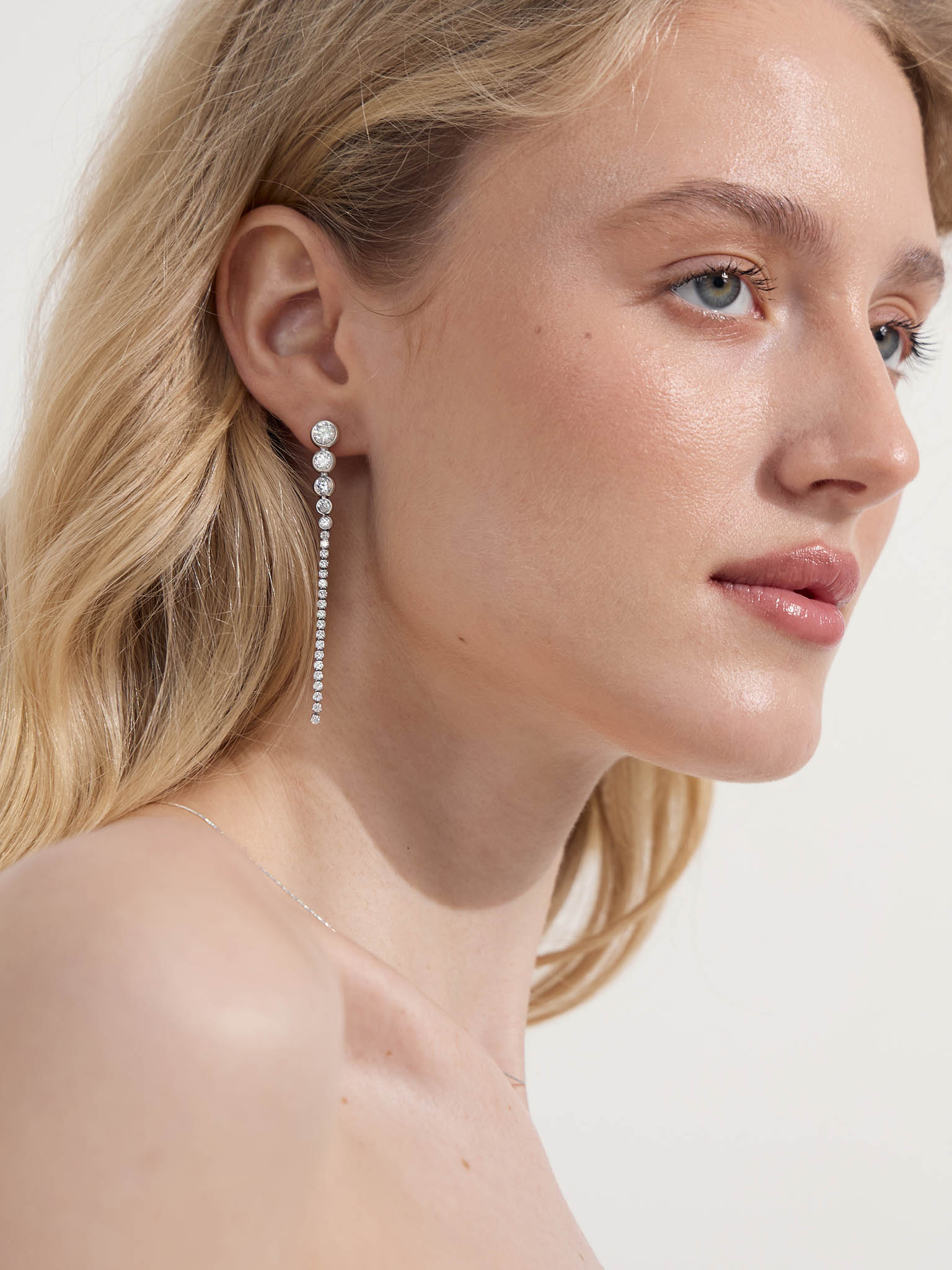 Long stud earrings with zircons