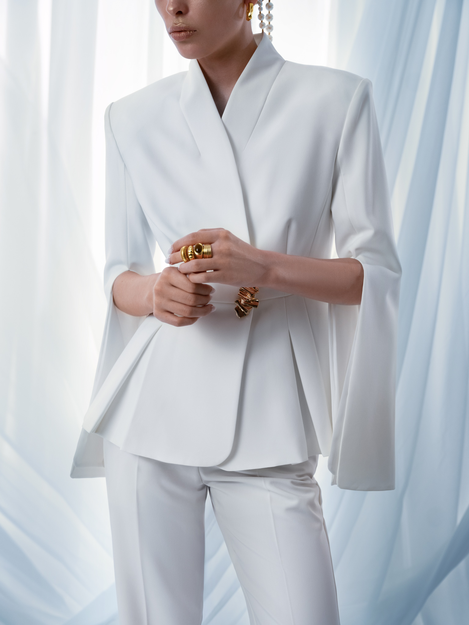 Flared jacket with slits on sleeves