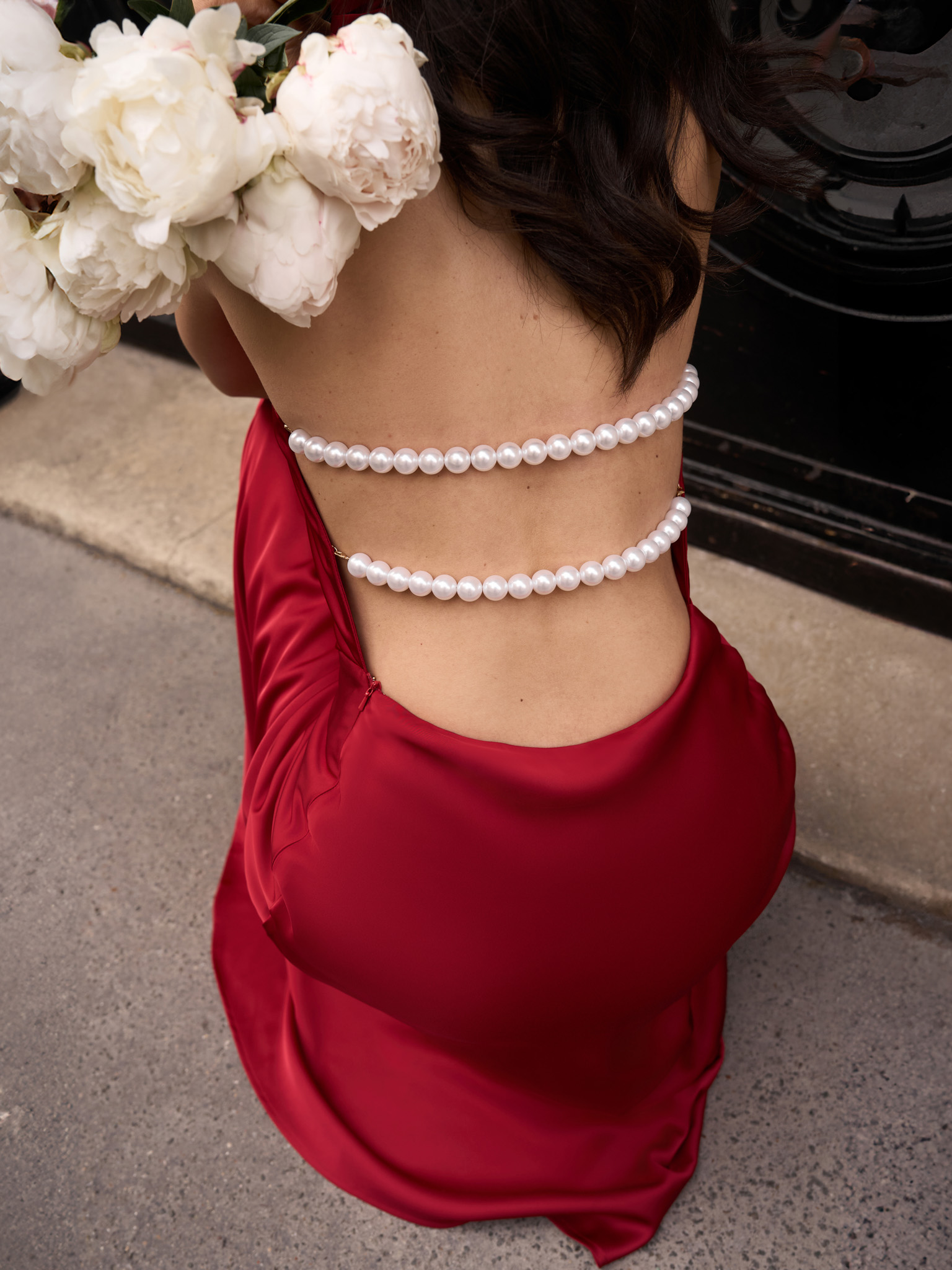 Satin maxi dress with pearl decor on the back