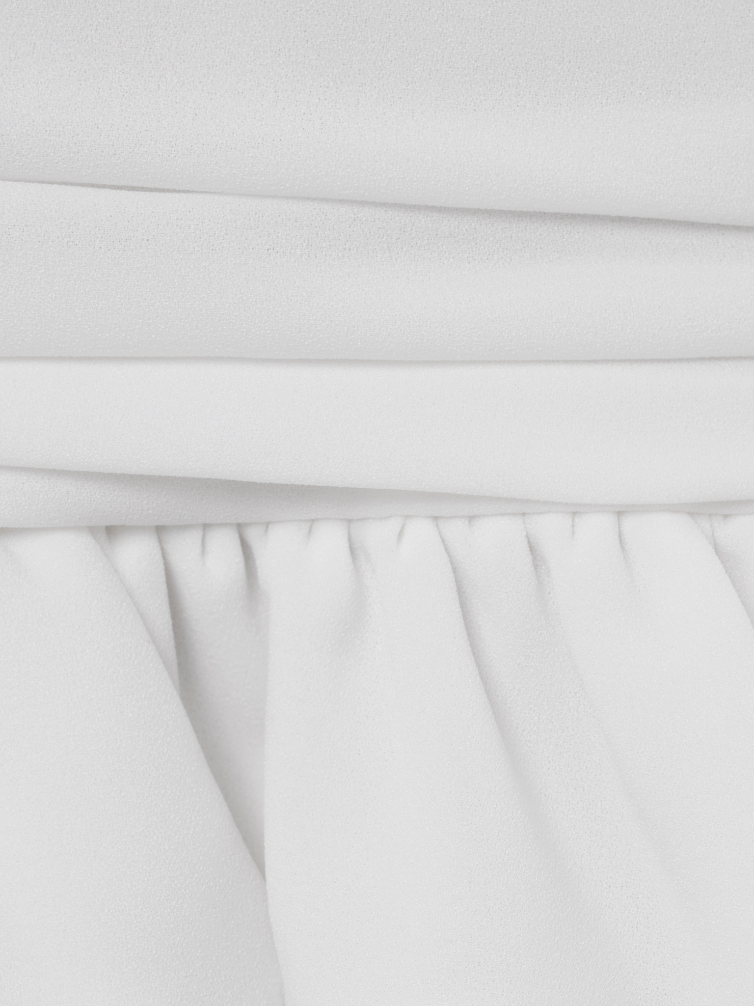 Voluminous mini dress with ruffles on the skirt and ribbon scarf