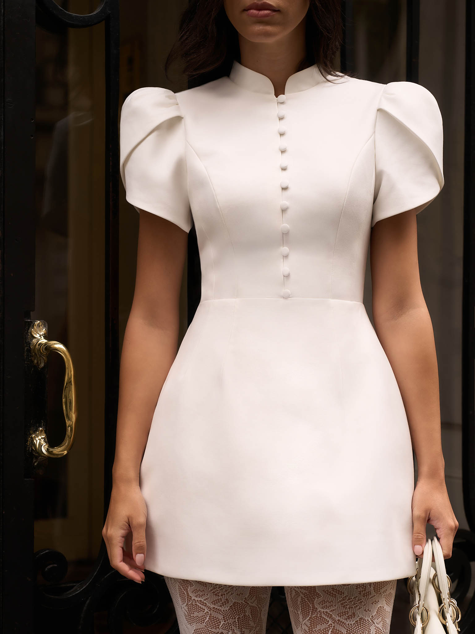 Mini dress with high collar and button fastening