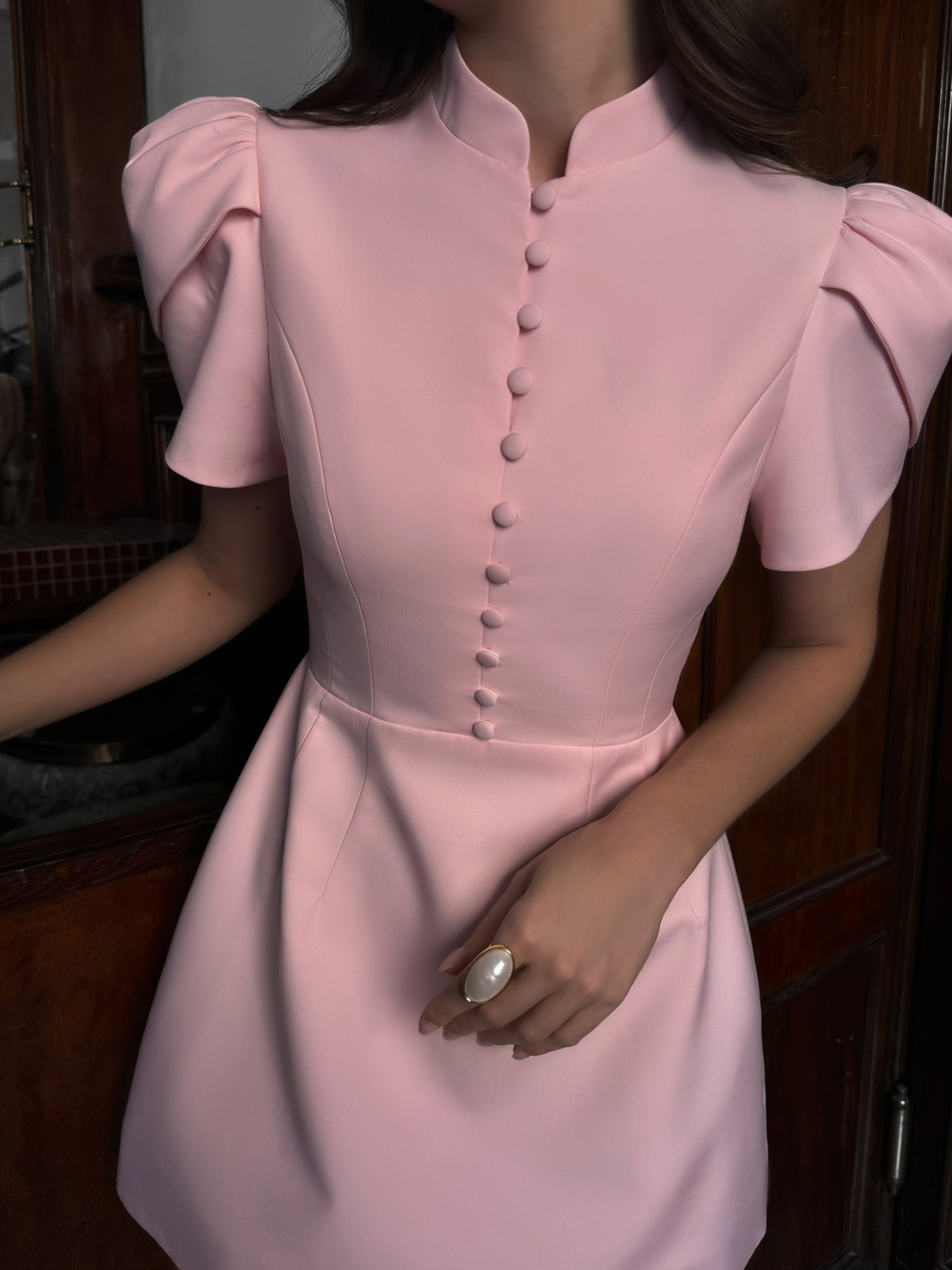 Mini dress with high collar and button fastening