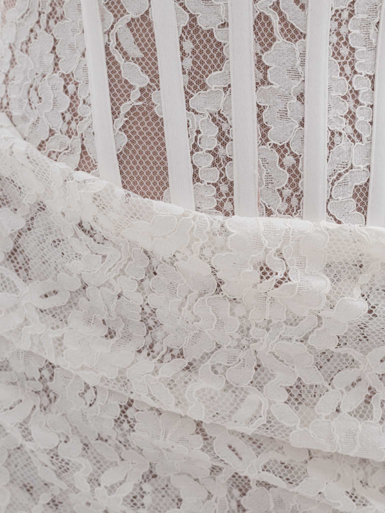 Lace mini dress with corset bodice and draped skirt