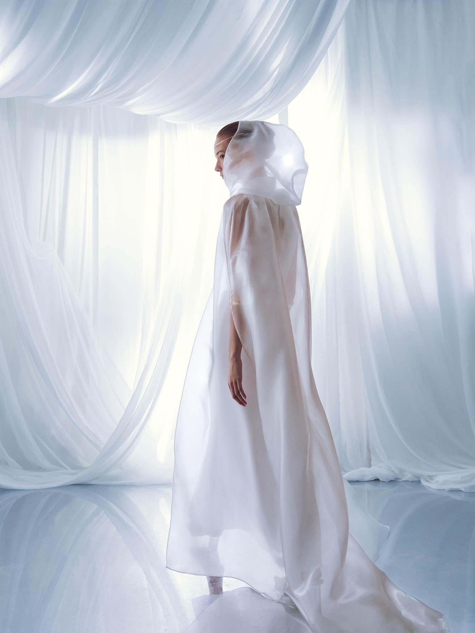 Lightweight cape with a hood