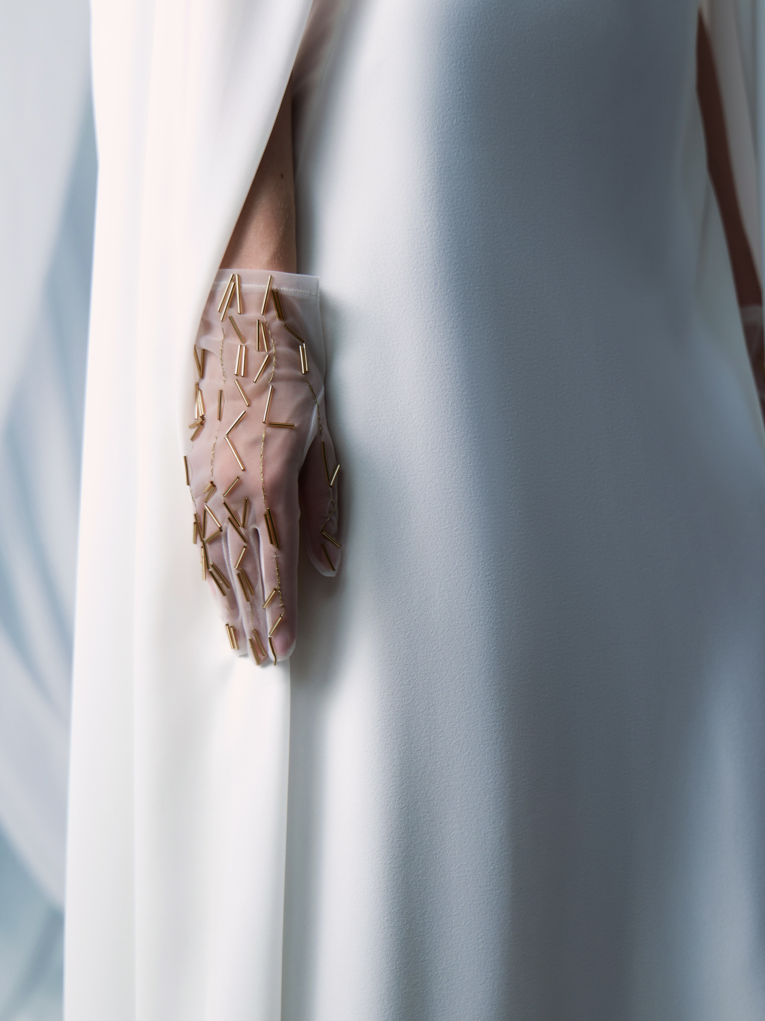 Semi-transparent gloves with golden decorations