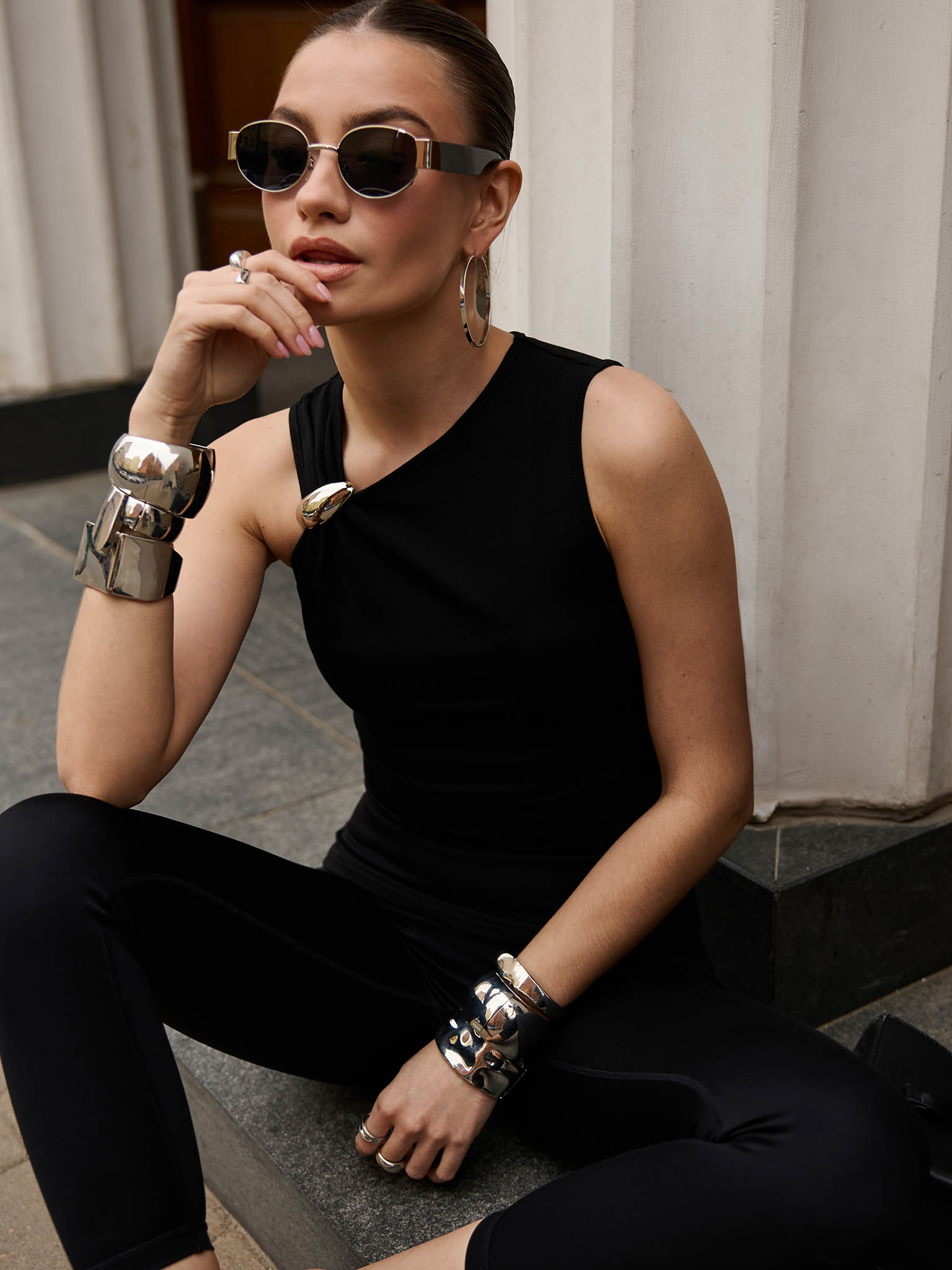 Top with asymmetrical straps and metal decorations