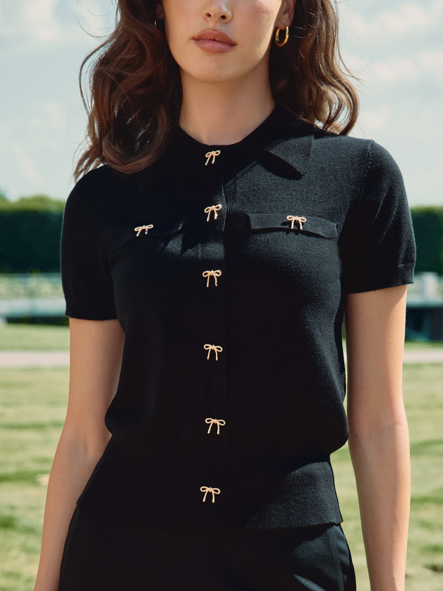 Cardigan with triangular collar and accent buttons