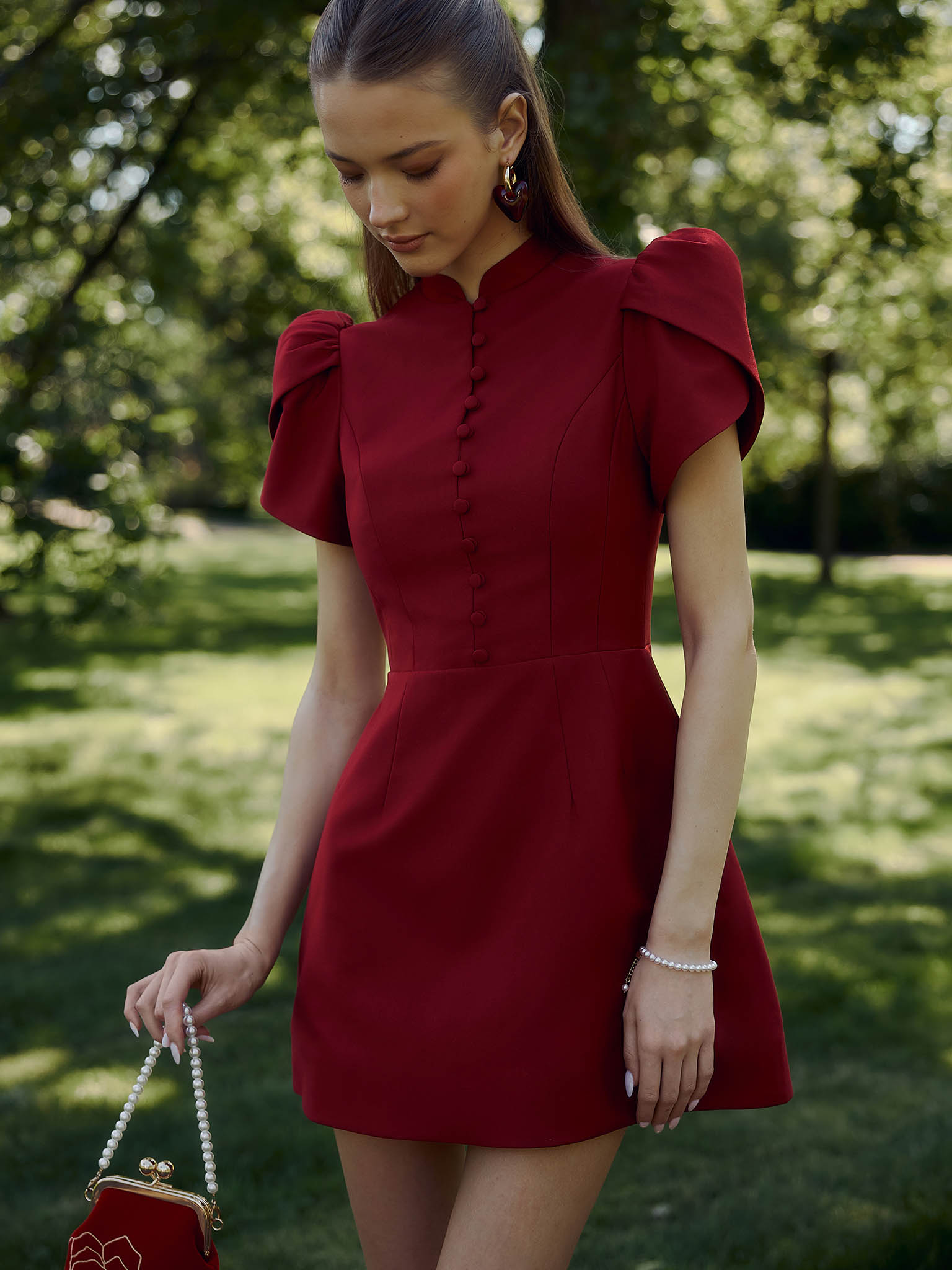 Mini dress with high collar and button fastening