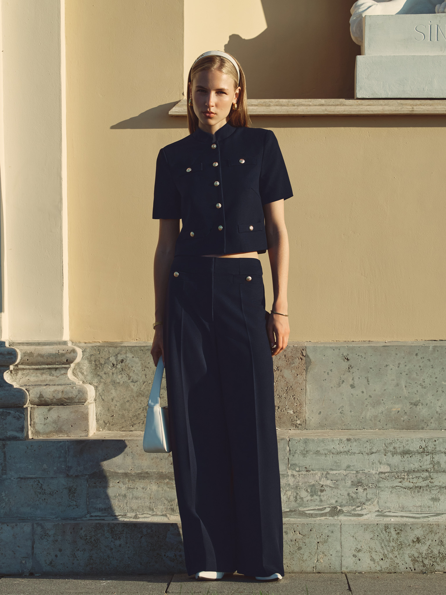 Jacket with short sleeves and oversized buttons