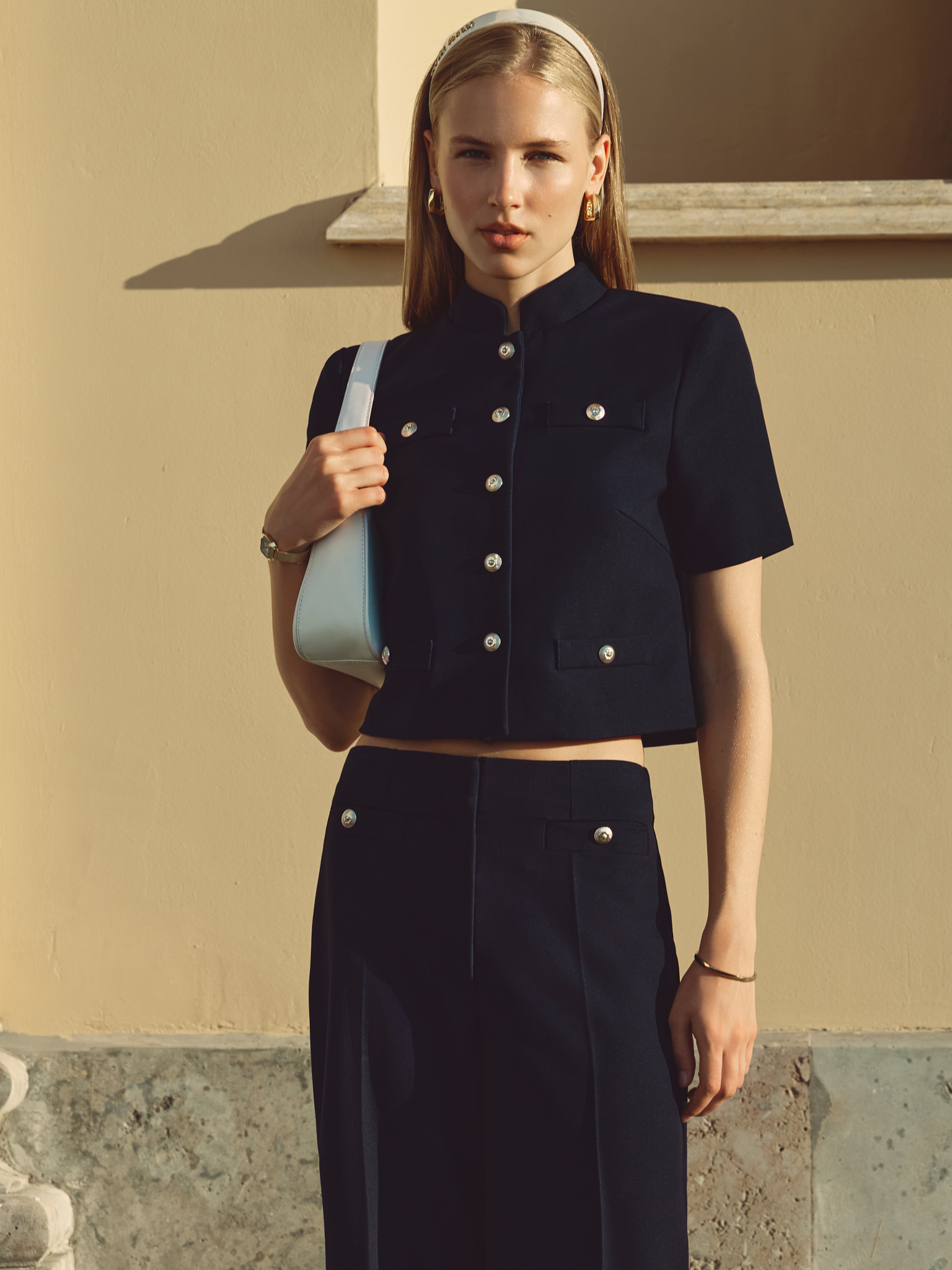 Jacket with short sleeves and oversized buttons