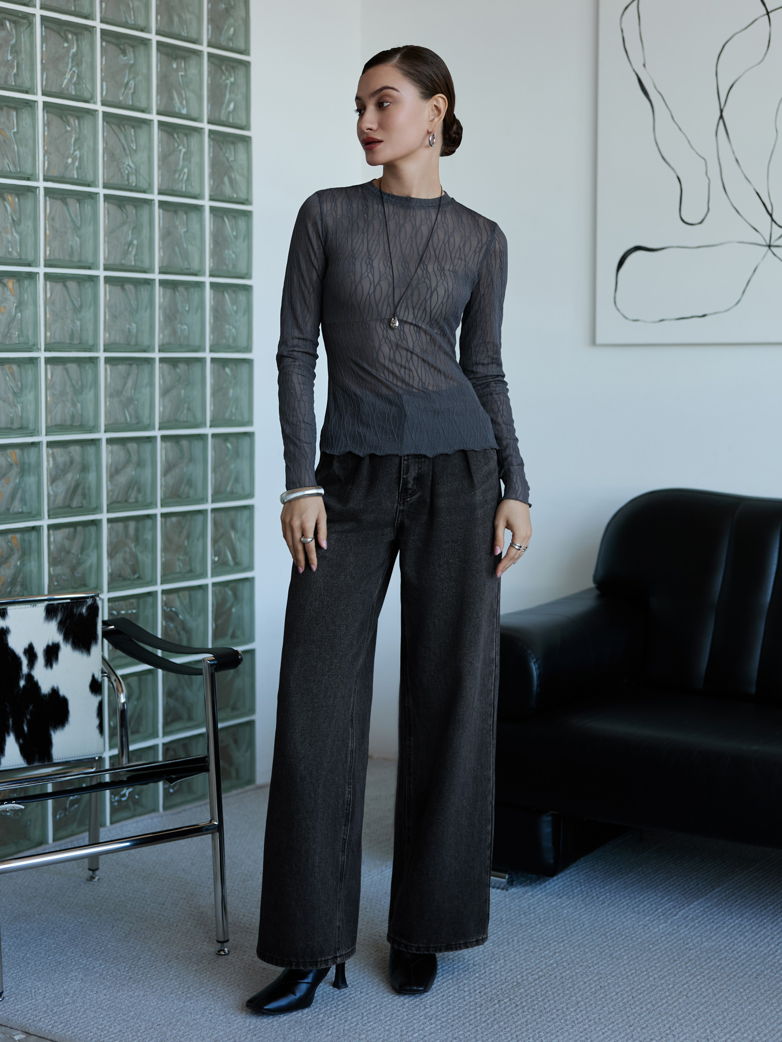 Loose jeans with waist pleats