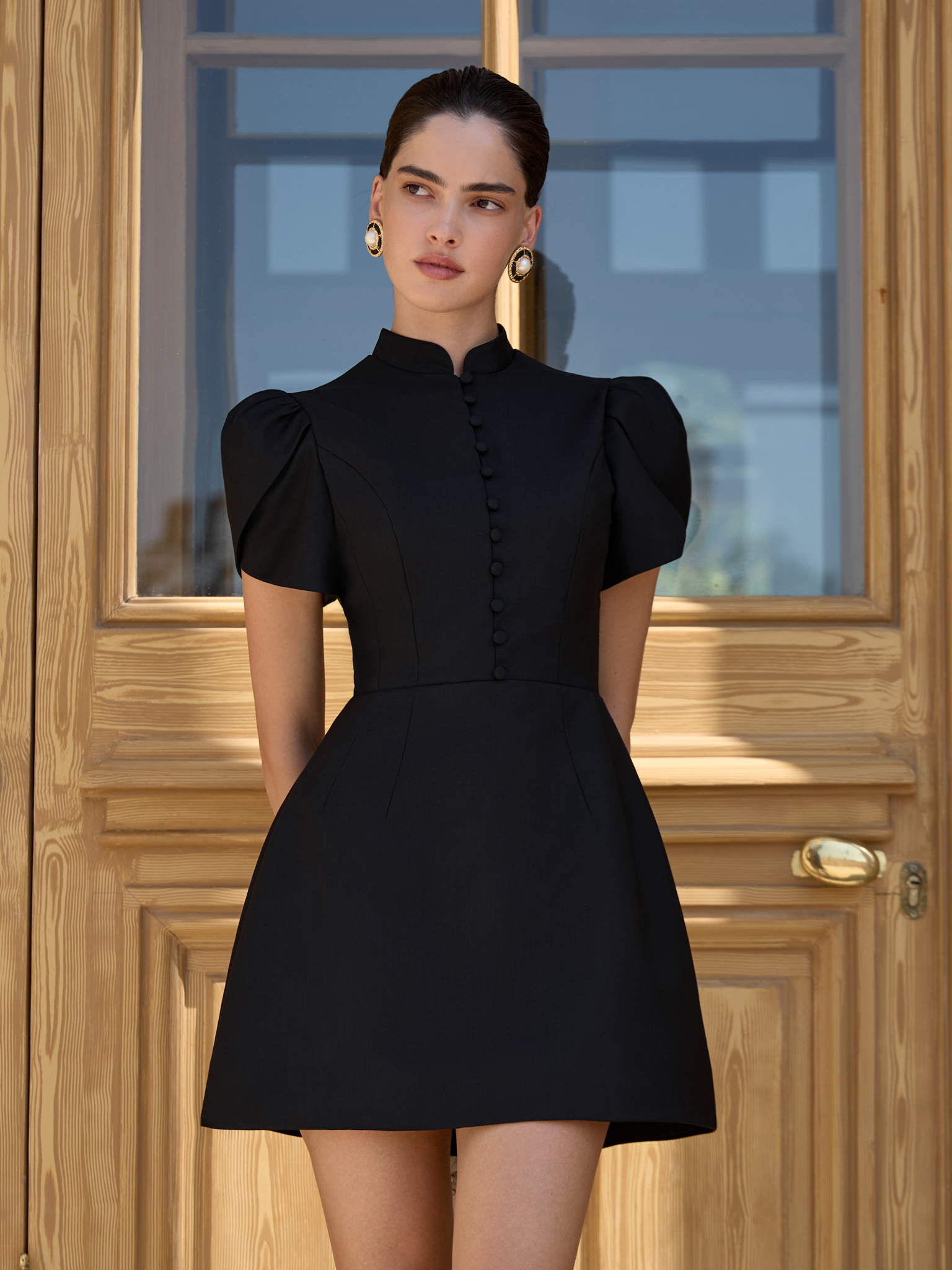 Mini dress with high collar and button fastening