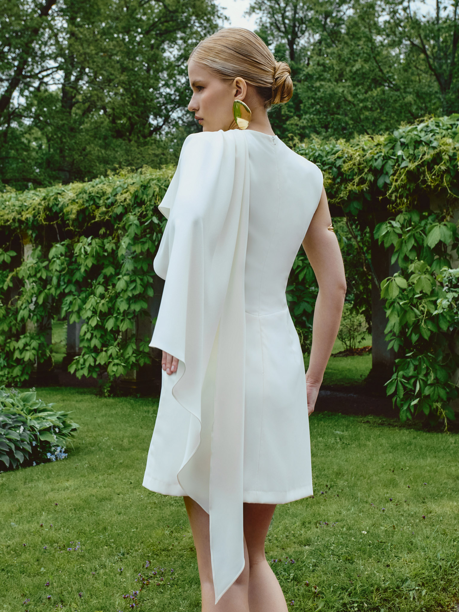 Fitted mini dress with asymmetric draping
